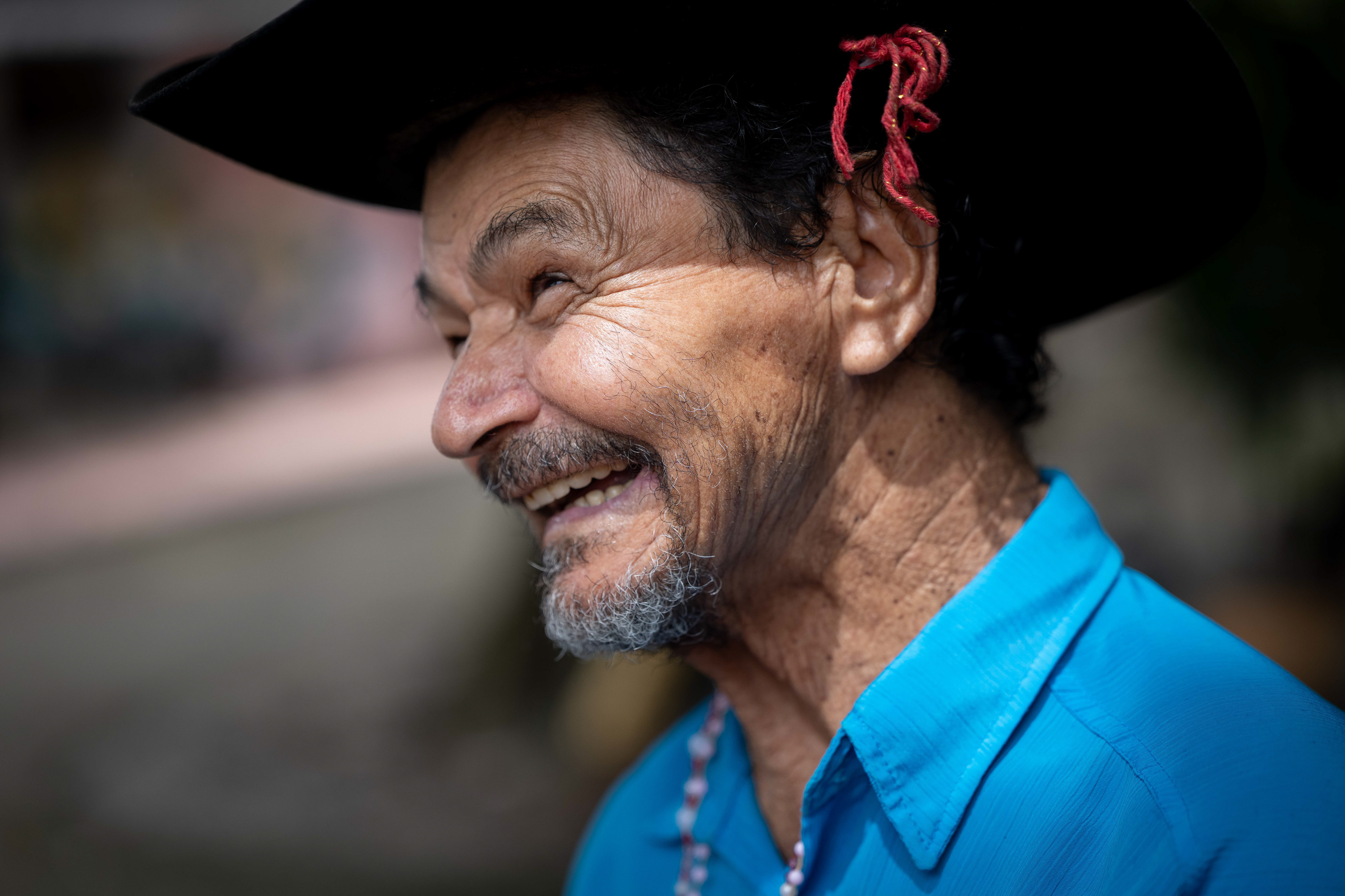 Pipa visits with people at the Saint Vincent de Paul Home in Cidade de Goiás, Go., Friday, March 6, 2026. Living with an intellectual disability, he often turns to music as a way to spend his time. 
