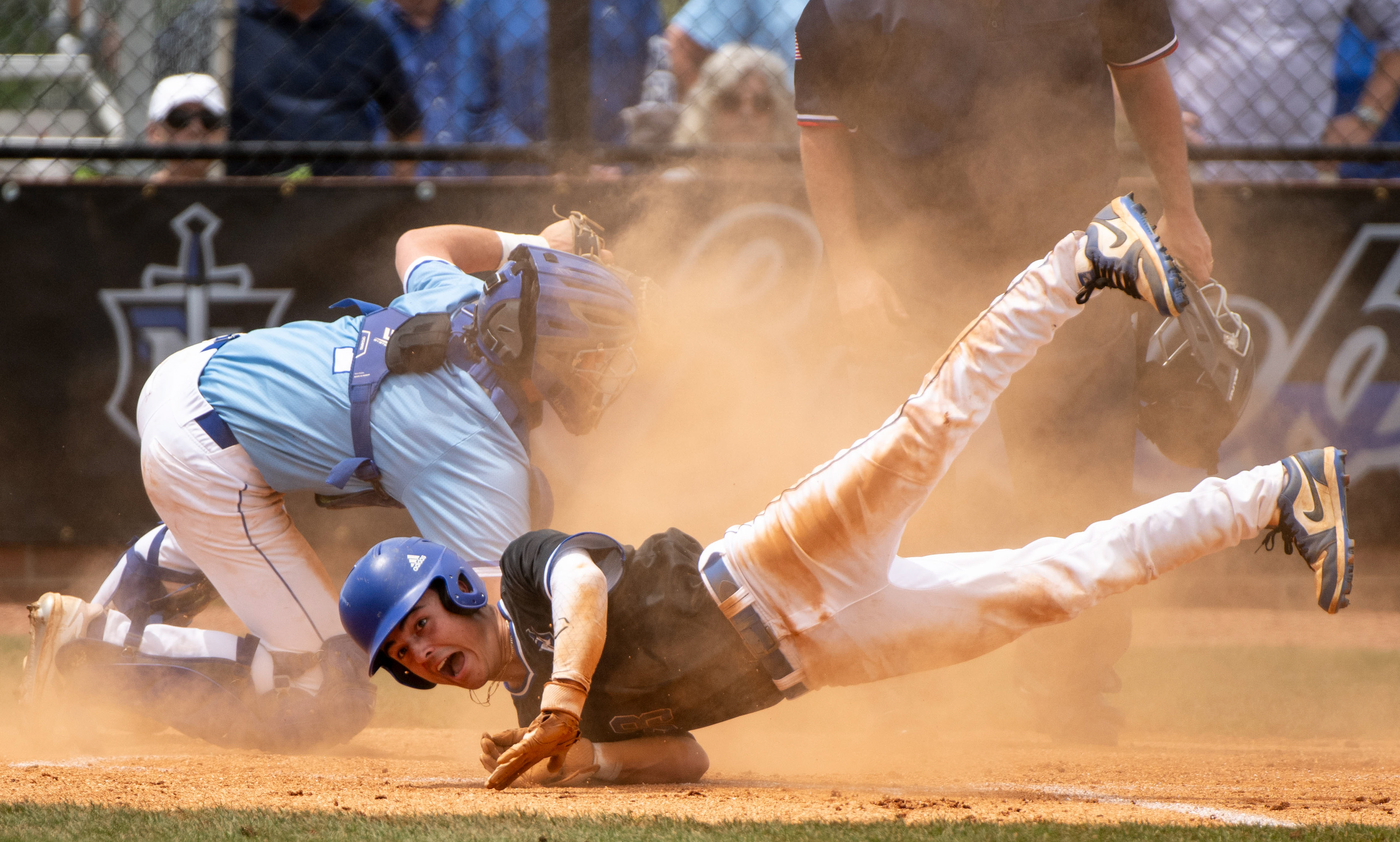 Nolensville High School (38) Keagan Meece crashes into home plate during his game against Brentwood High School at Nolensville High School in Nolensville, Tenn., Sunday, May 5, 2024.