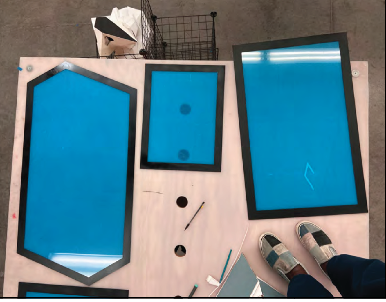 Painting the Borders of the Acrylic to Hide the Silicon Sealant