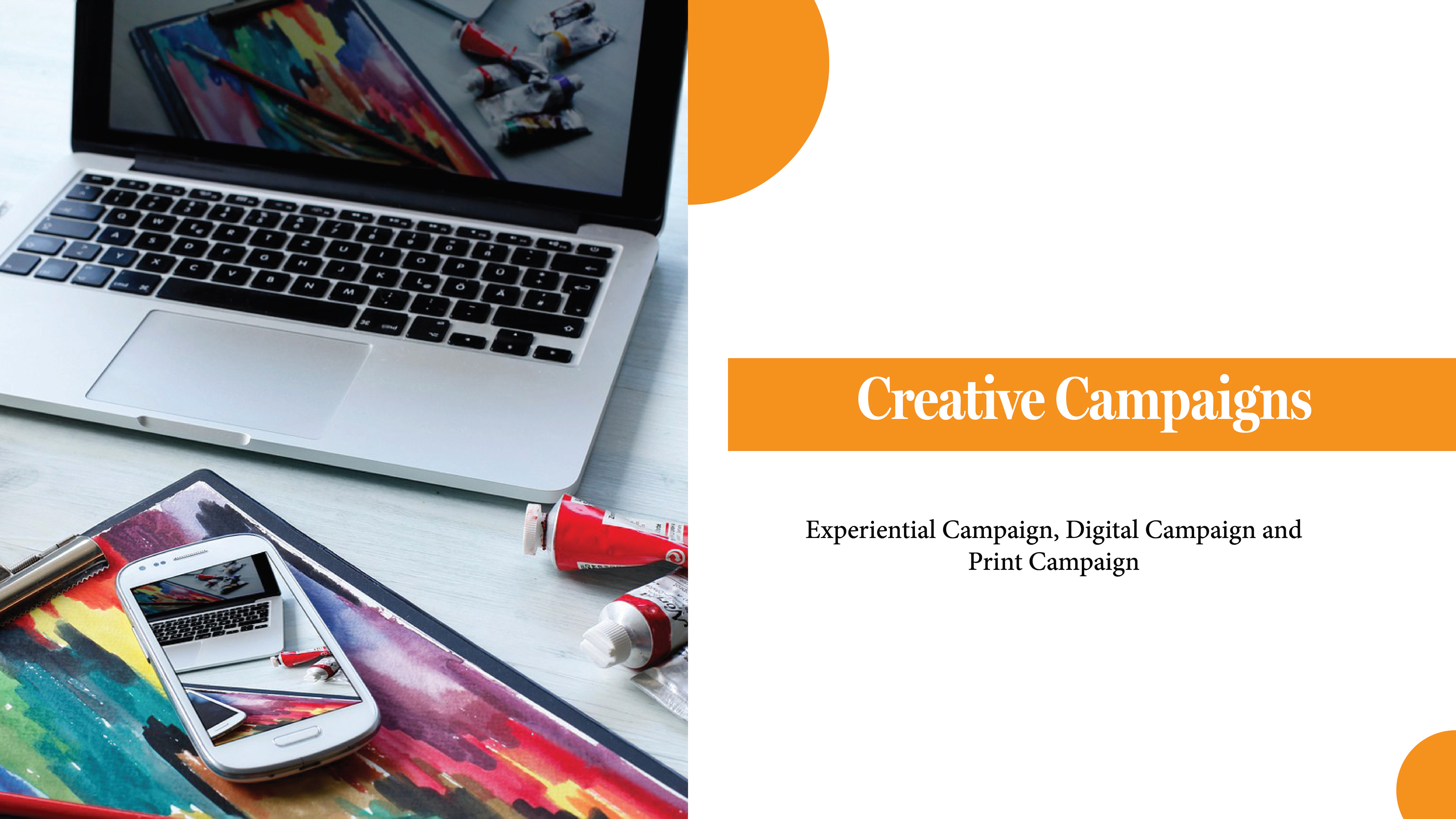 This slide on the presentation has an image showing a computer that has art supplies around it and on the right side has the words Creative Campaign in a white colour with a orange background. The words experimental campaign, print campaign in a black colour.