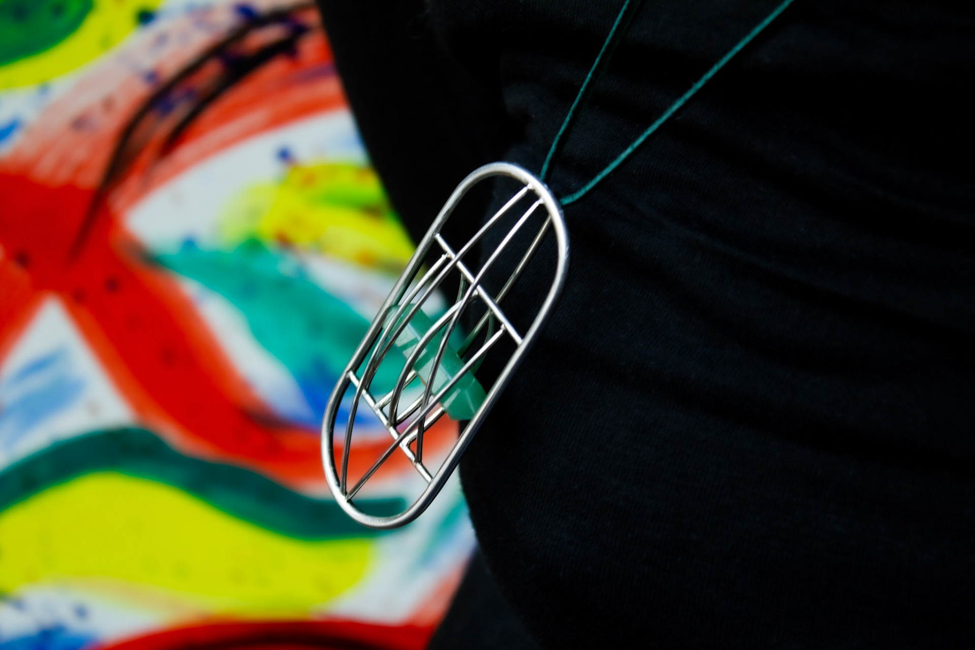 Aviary pendant. Stainless steel, jade.