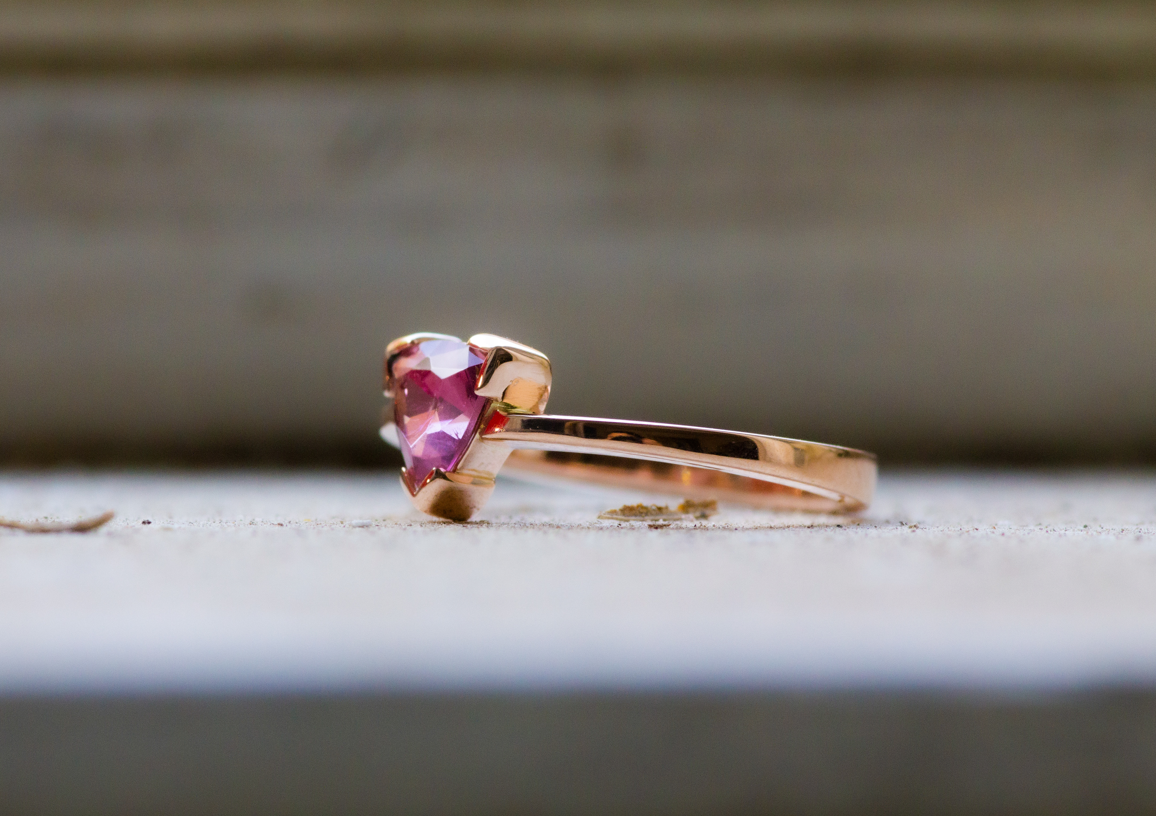 Rosè gold ring with a natural trillion cut pink tourmaline.