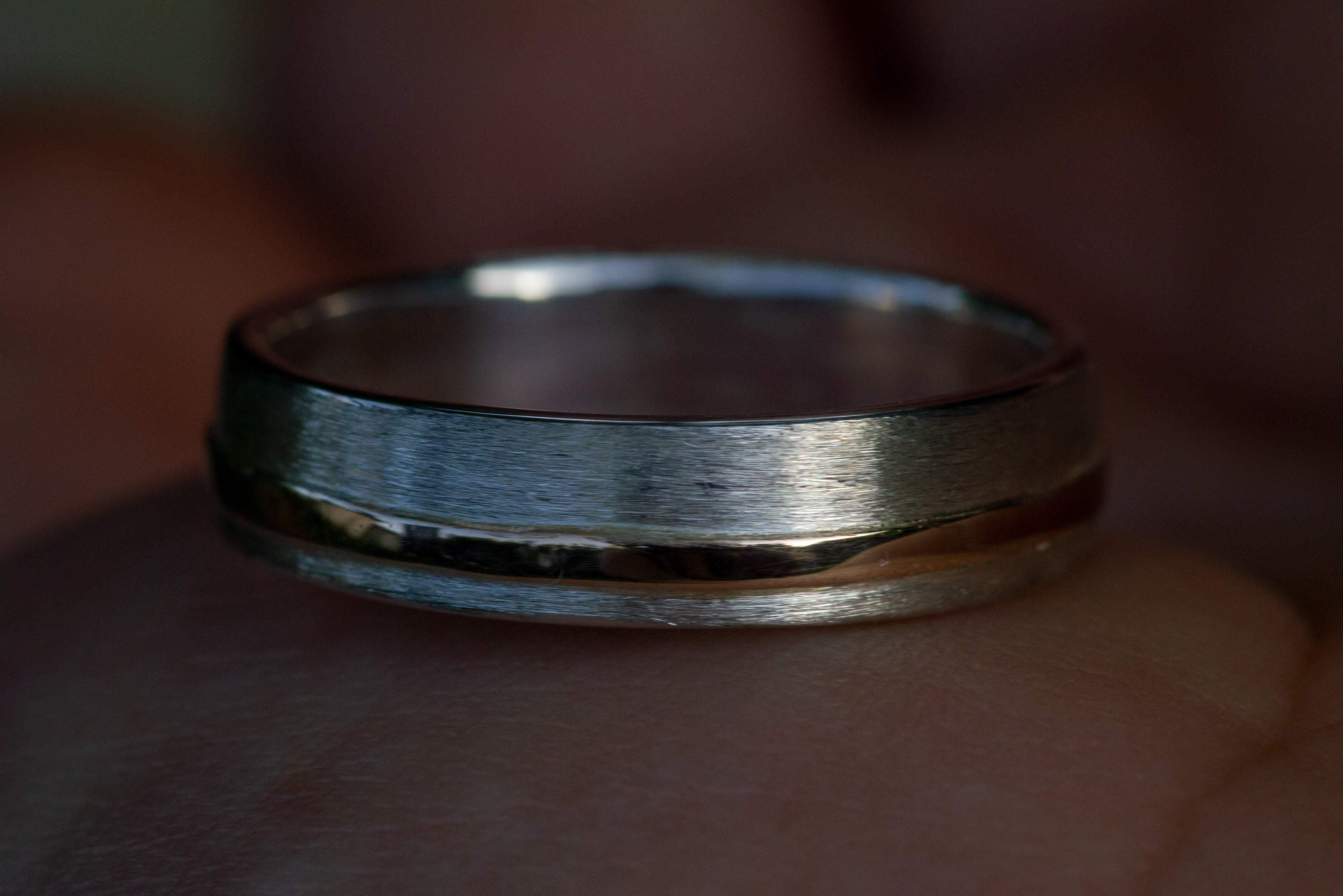 For I. Silver with red gold inlay. Satinated and polished.