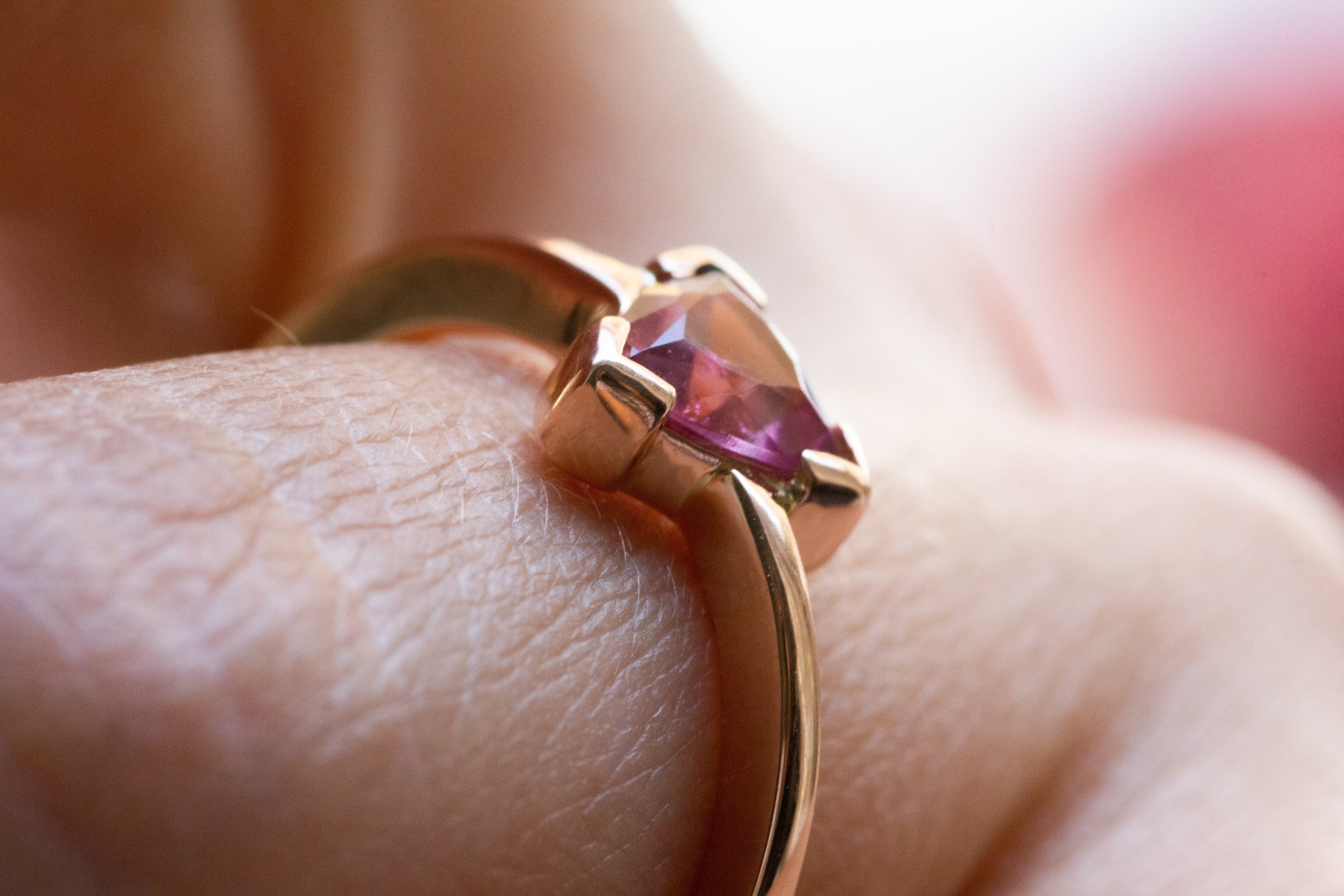 Rosè gold ring with a natural trillion cut pink tourmaline.