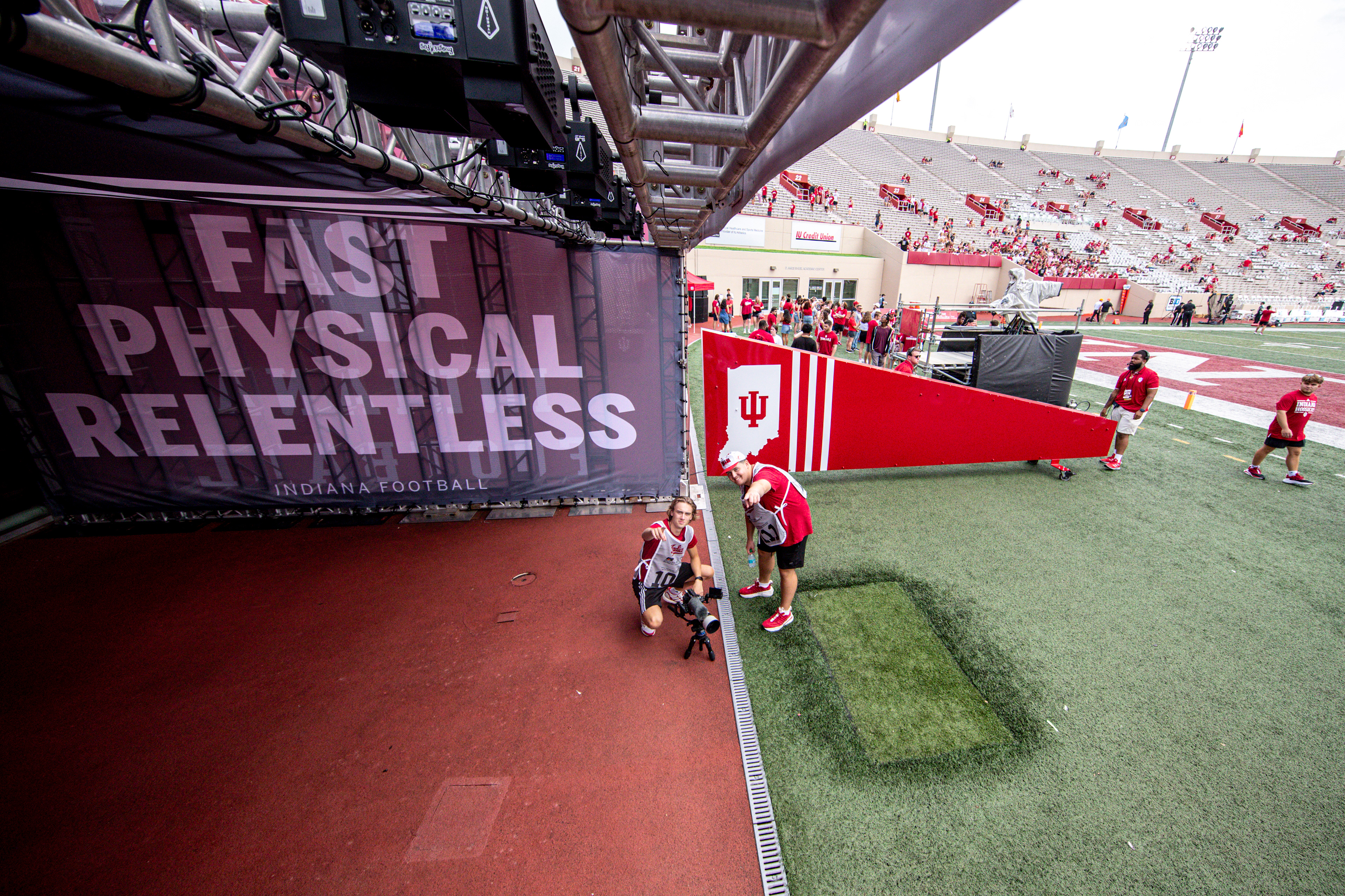Nathan Shawl and coworker/friend Caleb Wood getting ready for game time at Memorial Stadium.