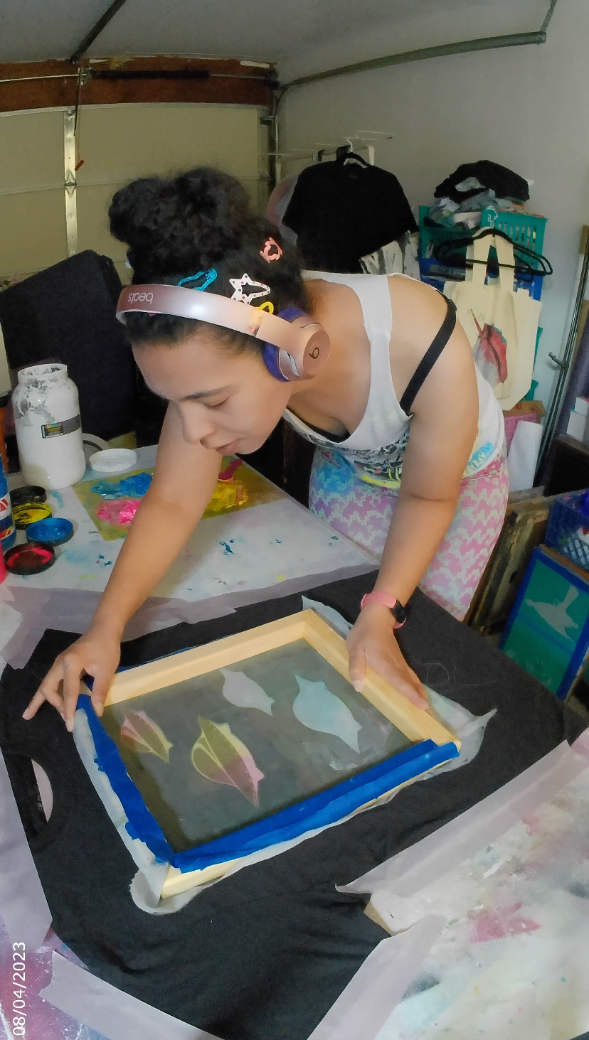 Adding the top layer of the neon UFO screen print, 2023