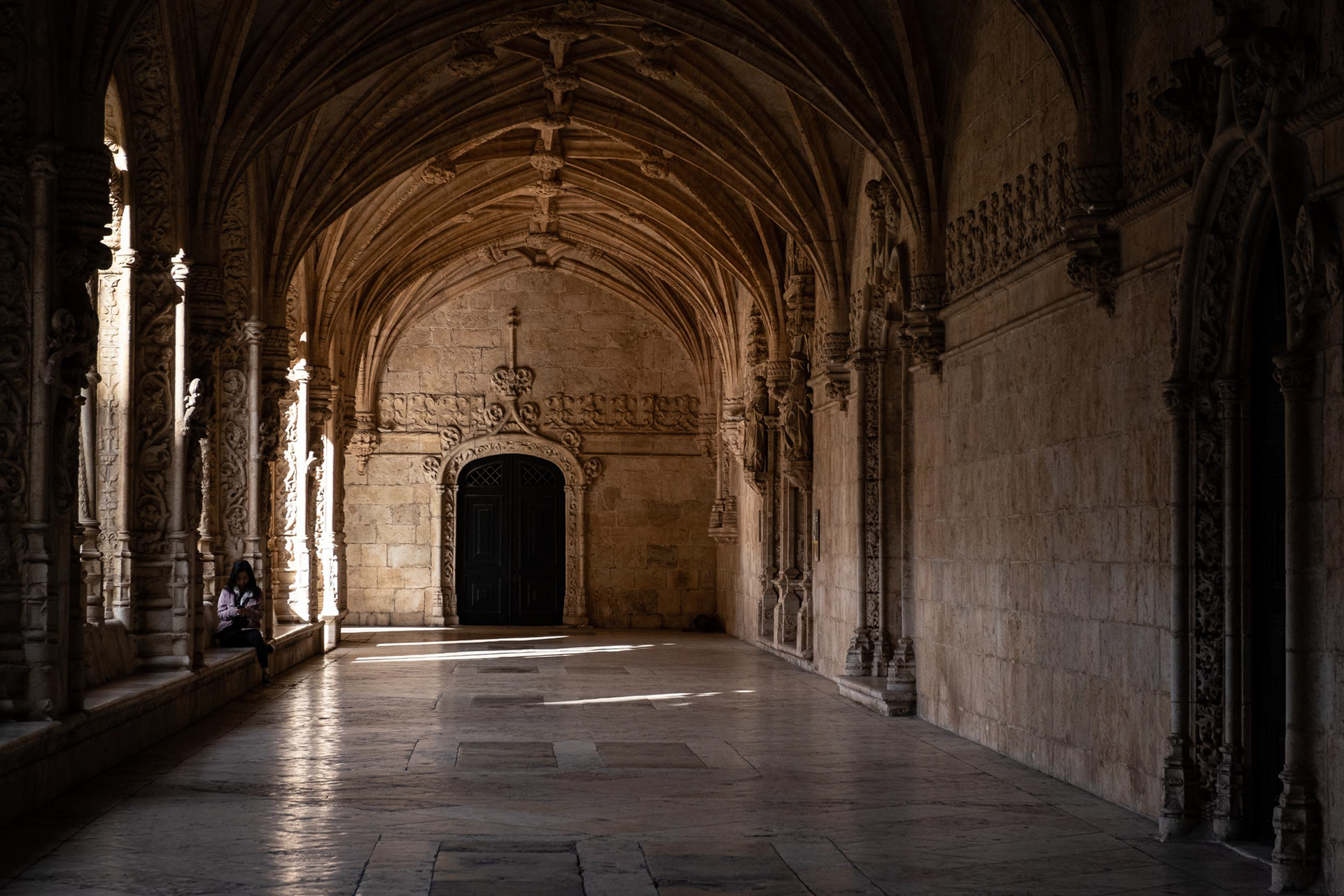 Sunlight illuminating parts of the cloiser in Mosteiro dos Jeronymos in Lisbon