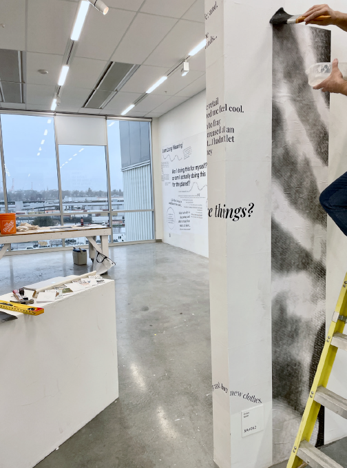 Installation set-up of wheat pasting 384 sheets of paper on to the Knee Gallery wall over 24 hours (2 days)