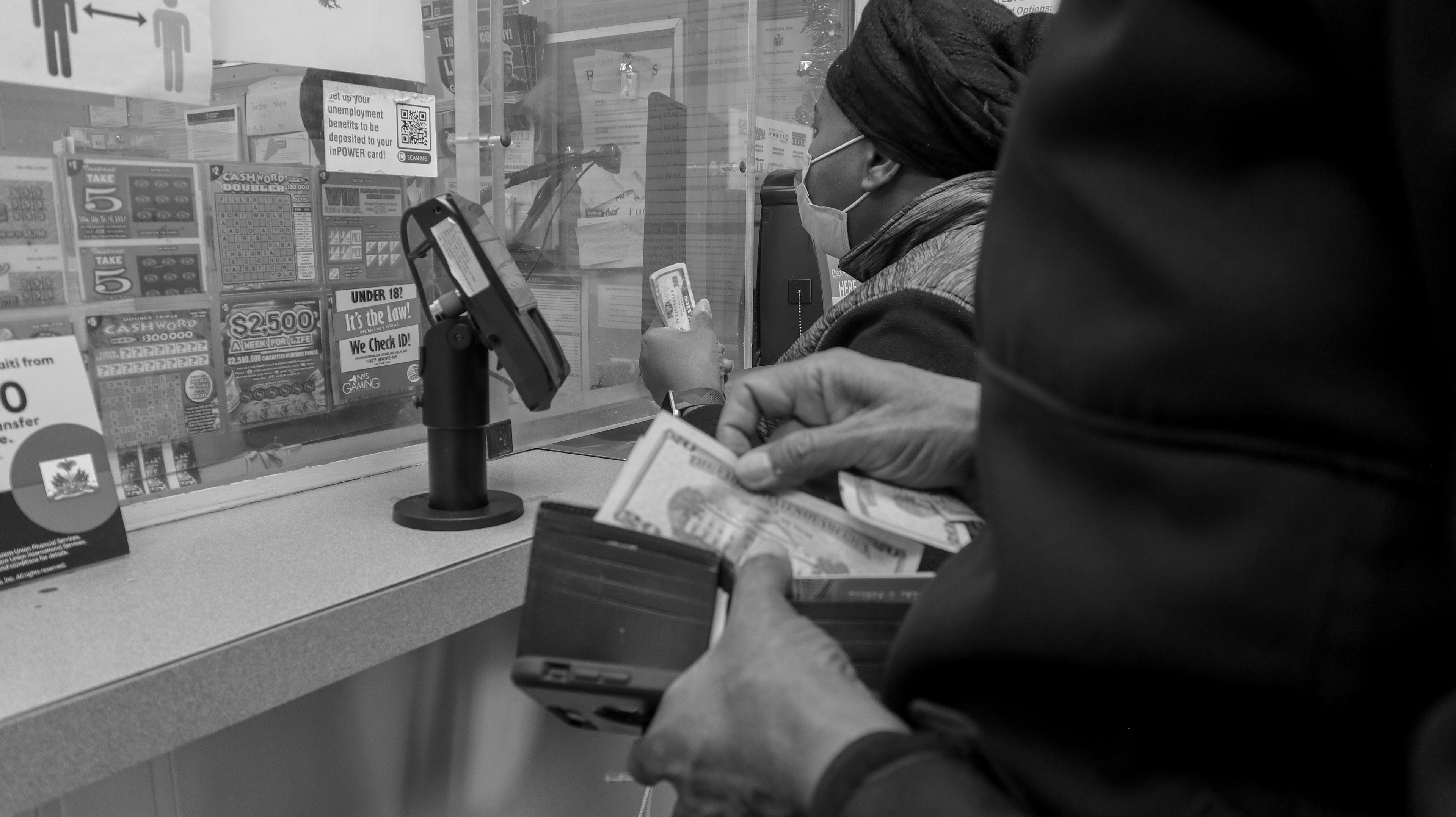 Once the name is confirmed, Jean takes out more cash to hand to Myrtho as she makes the final transfer with a cashier.