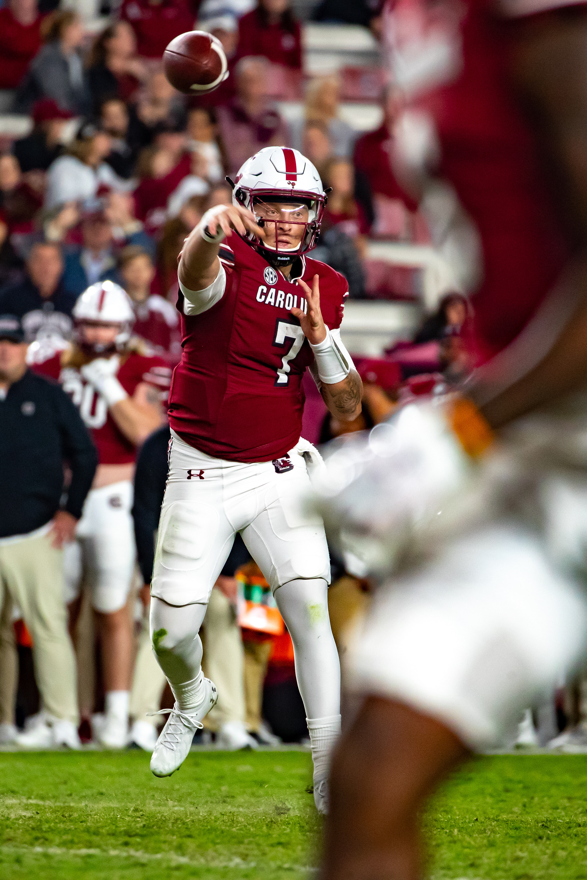Carolina quarterback Spencer Rattler throws the ball down-field.