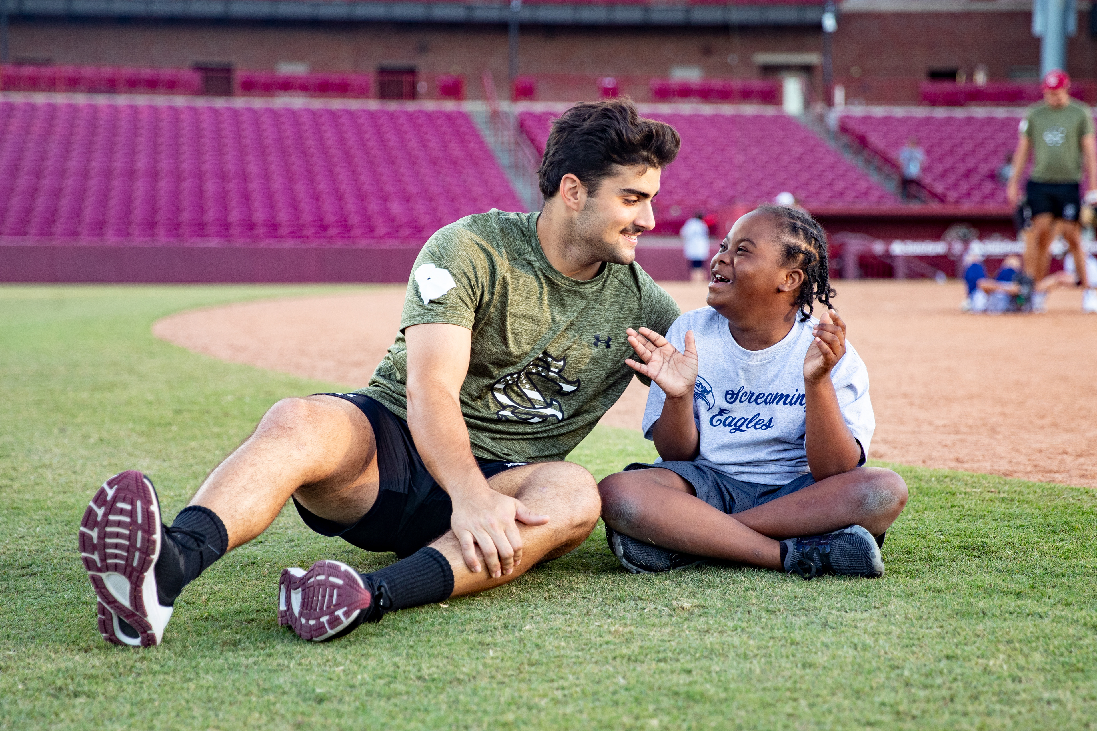  Freshman Zander Buchan interacts with an athlete of the Screaming Eagles Special Needs Athletics.