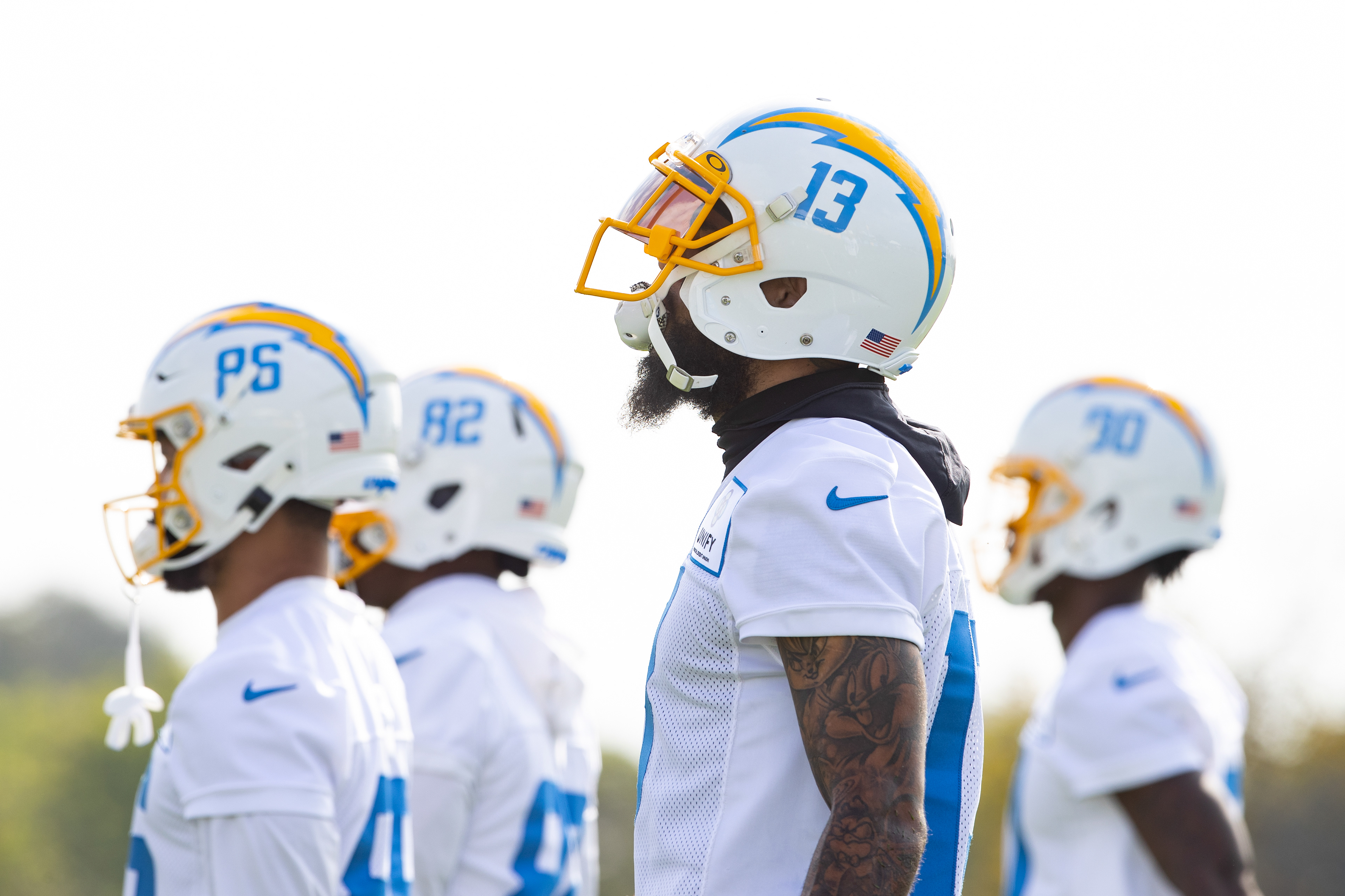 Los Angeles Chargers wide receiver Keenan Allen listens to coaches during practice.