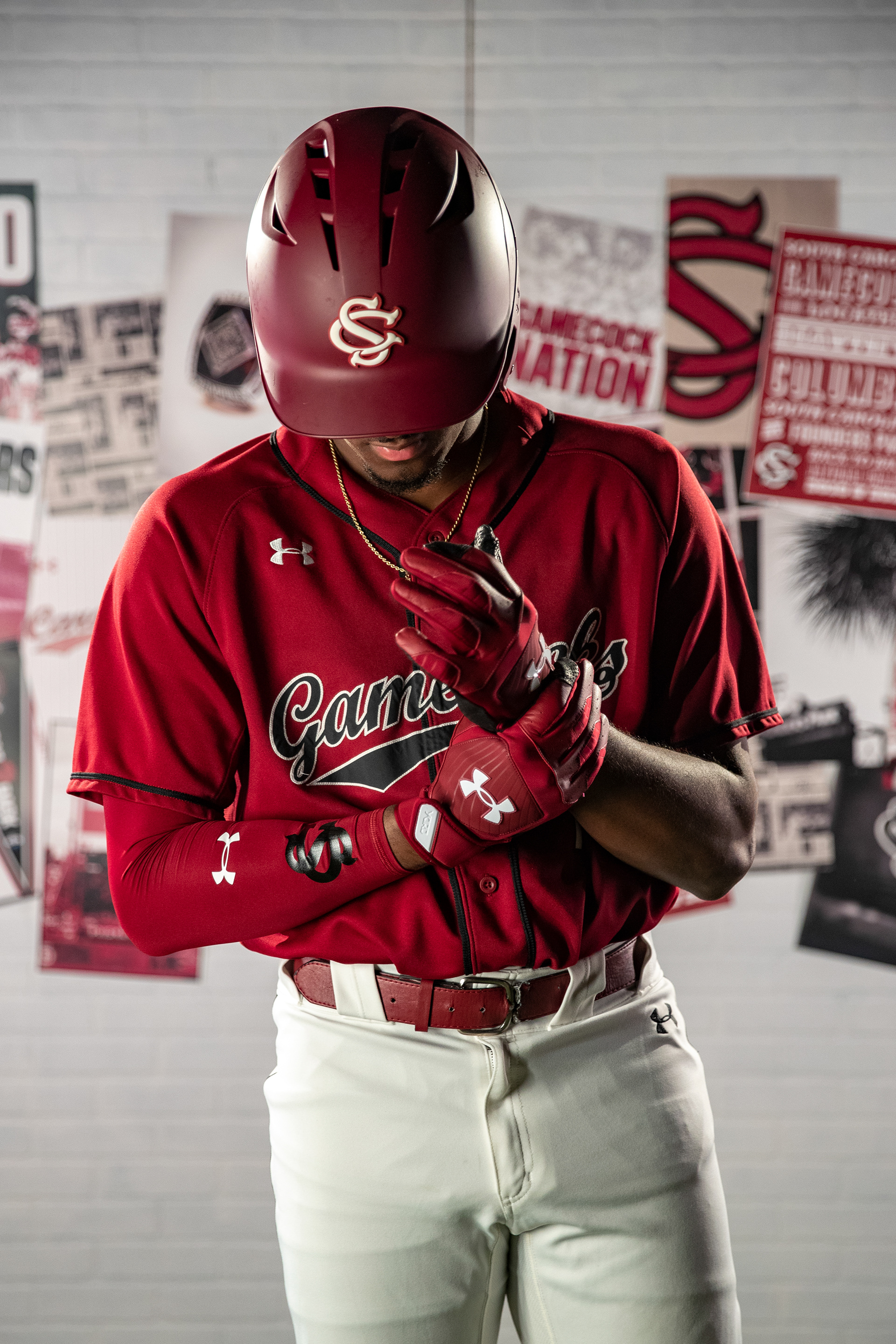Sophomore Michael Braswell puts on his gloves during media day.
