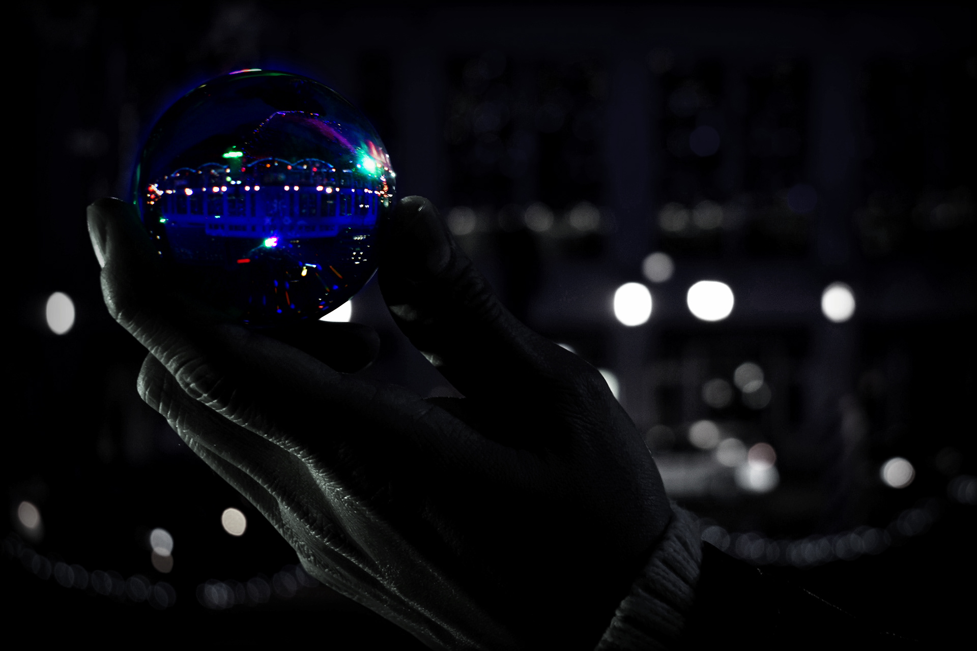 Orb in hand with Christmas lights - Indianapolis, Indiana, USA