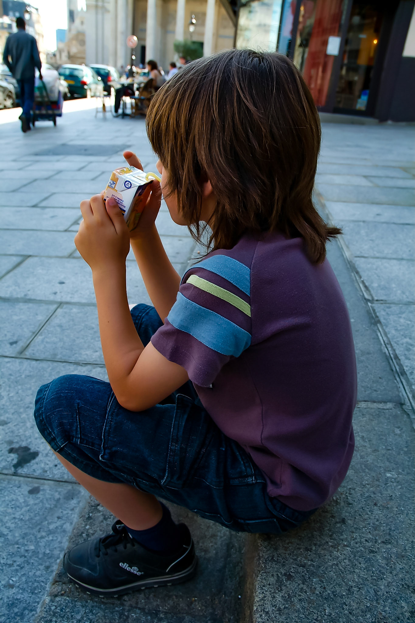 Small boy drinking outside Pantheon Paris