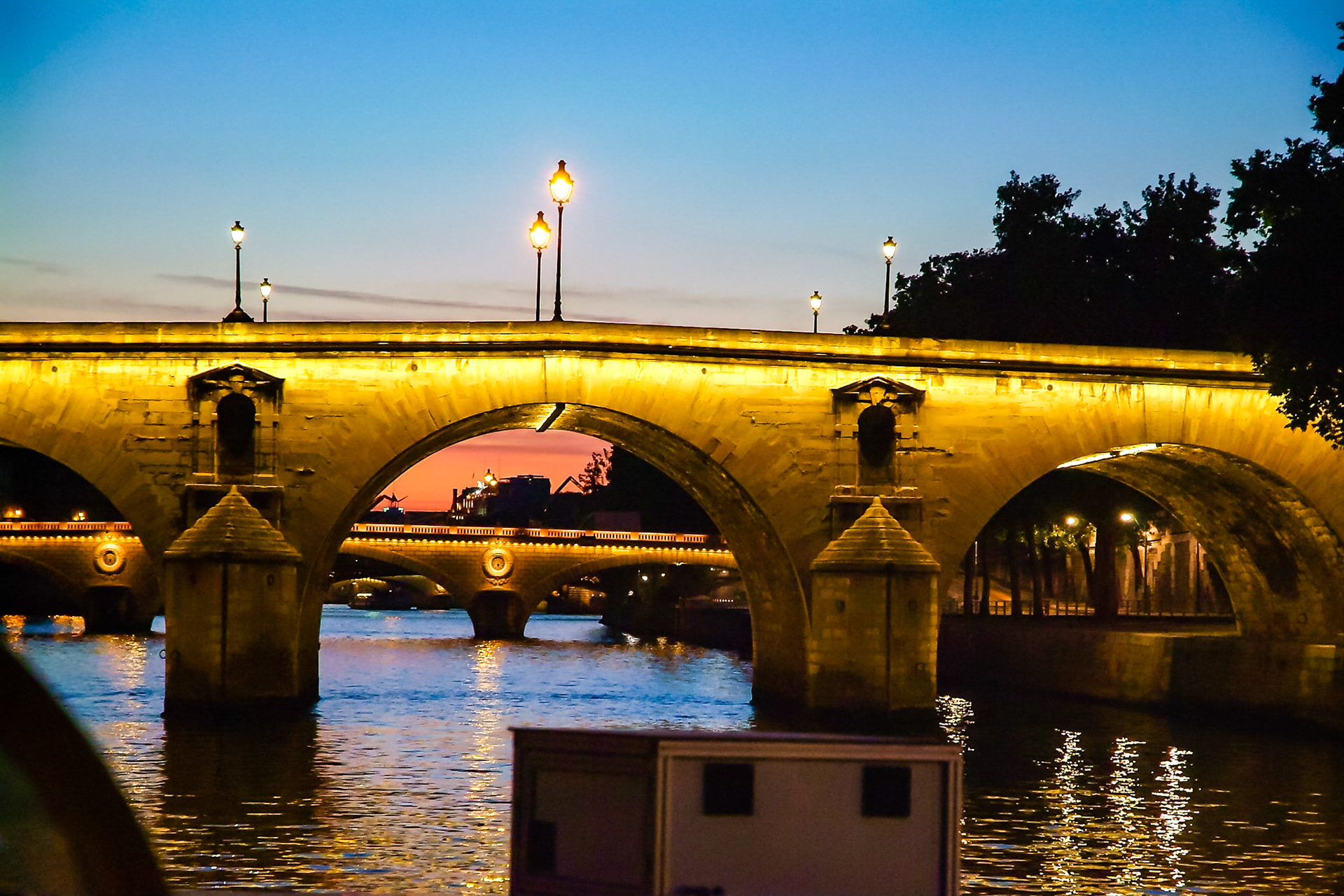 Night time view of Paris bridge