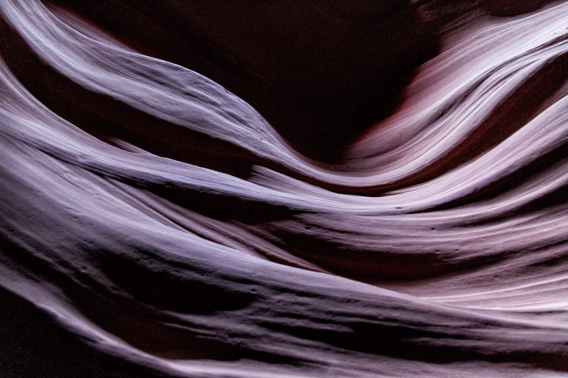 Antelope Canyon is the most-visited and most-photographed slot canyon in the American Southwest. It is located on Navajo land near Page, Arizona. Antelope Canyon includes two separate, photogenic slot canyon sections, referred to individually as Upper Antelope Canyon or The Crack; and Lower Antelope Canyon or The Corkscrew.The Navajo name for Upper Antelope Canyon is Tsé bighánílíní, which means "the place where water runs through rocks."