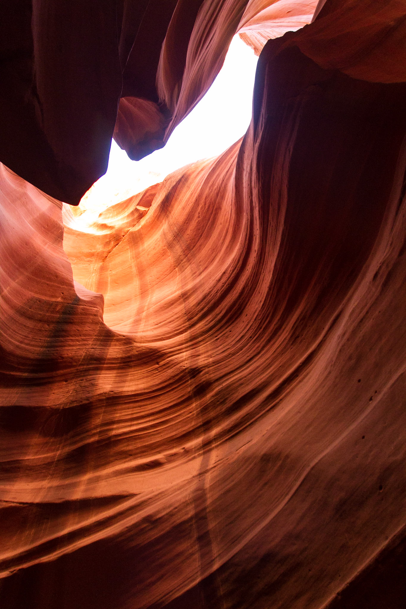 Antelope Canyon is the most-visited and most-photographed slot canyon in the American Southwest. It is located on Navajo land near Page, Arizona. Antelope Canyon includes two separate, photogenic slot canyon sections, referred to individually as Upper Antelope Canyon or The Crack; and Lower Antelope Canyon or The Corkscrew.The Navajo name for Upper Antelope Canyon is Tsé bighánílíní, which means "the place where water runs through rocks."