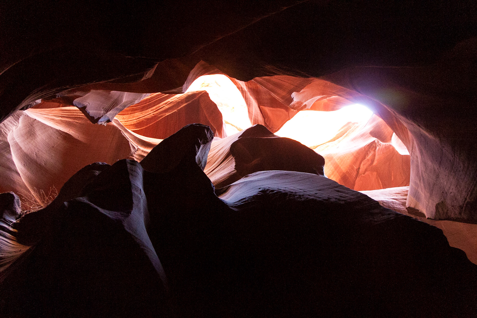 Antelope Canyon is the most-visited and most-photographed slot canyon in the American Southwest. It is located on Navajo land near Page, Arizona. Antelope Canyon includes two separate, photogenic slot canyon sections, referred to individually as Upper Antelope Canyon or The Crack; and Lower Antelope Canyon or The Corkscrew.The Navajo name for Upper Antelope Canyon is Tsé bighánílíní, which means "the place where water runs through rocks."