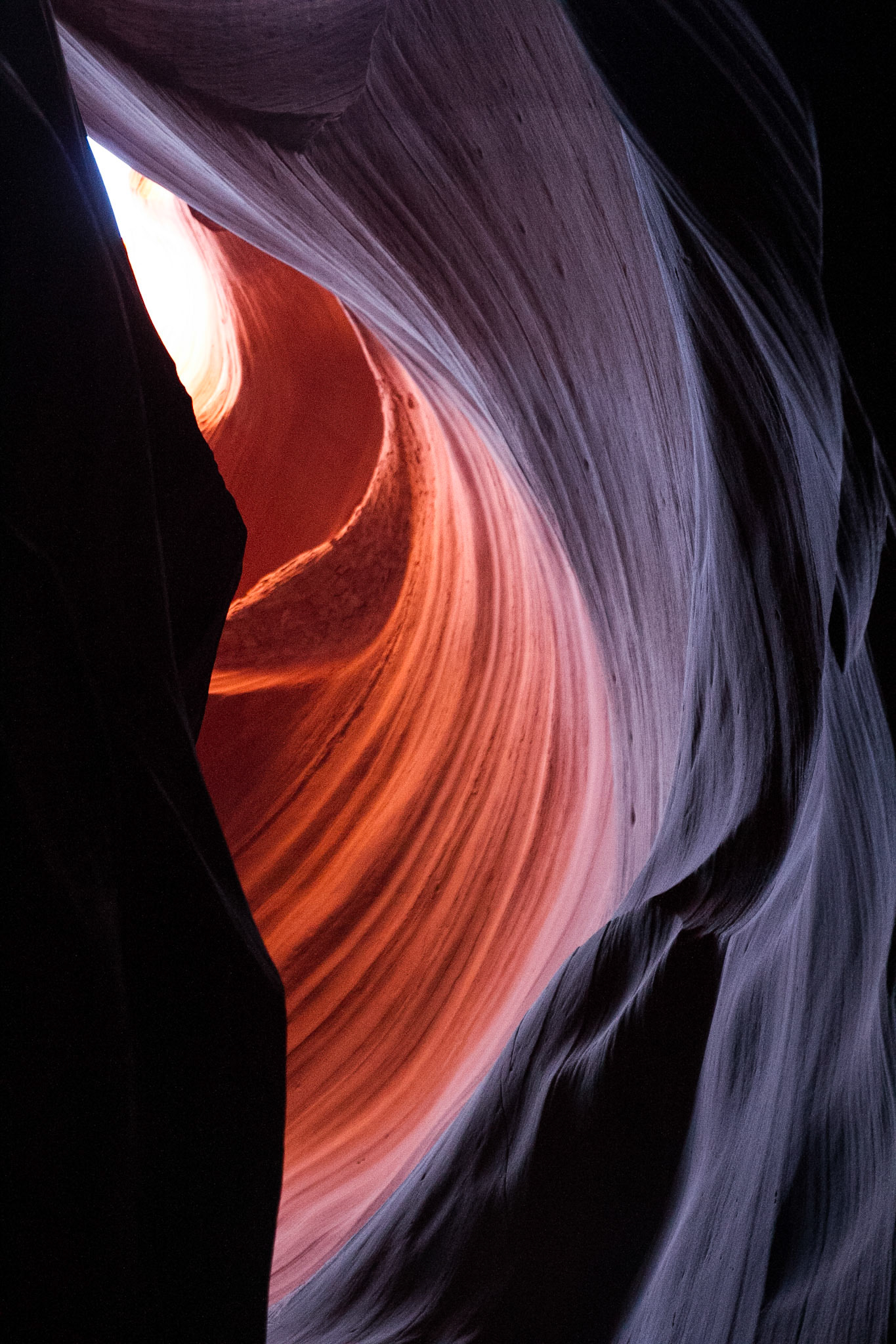Antelope Canyon is the most-visited and most-photographed slot canyon in the American Southwest. It is located on Navajo land near Page, Arizona. Antelope Canyon includes two separate, photogenic slot canyon sections, referred to individually as Upper Antelope Canyon or The Crack; and Lower Antelope Canyon or The Corkscrew.The Navajo name for Upper Antelope Canyon is Tsé bighánílíní, which means "the place where water runs through rocks."