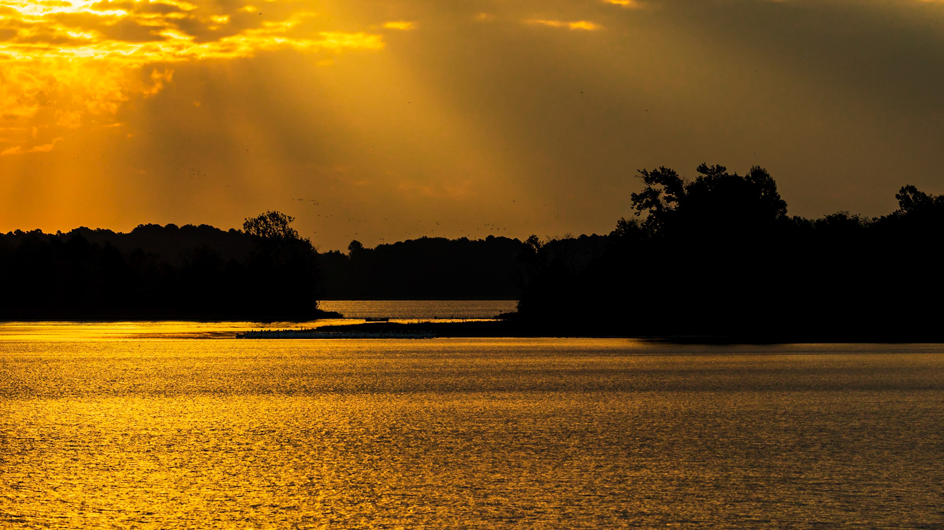 Sun streaks through the clouds.