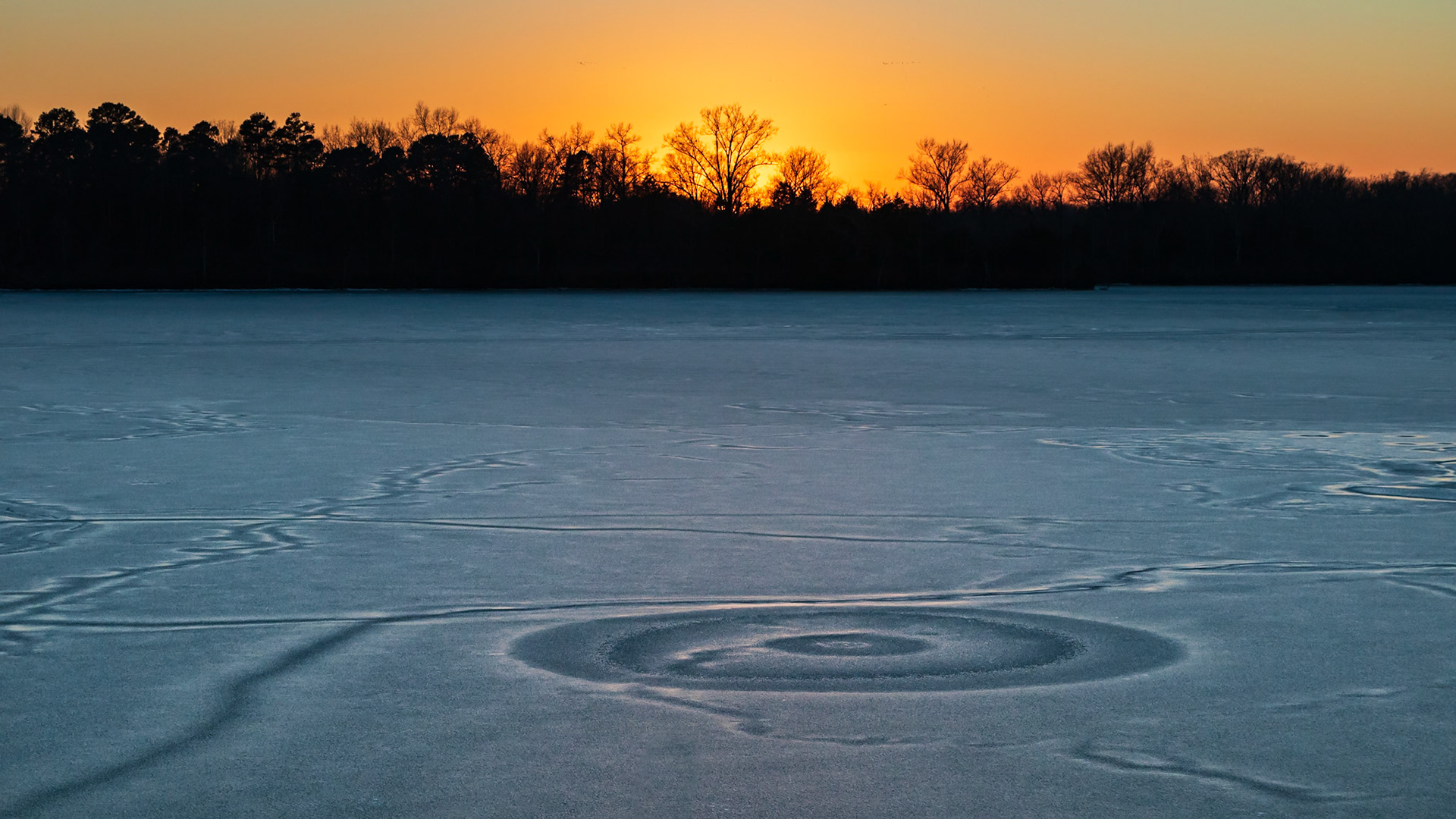 Frozen lake sunset.