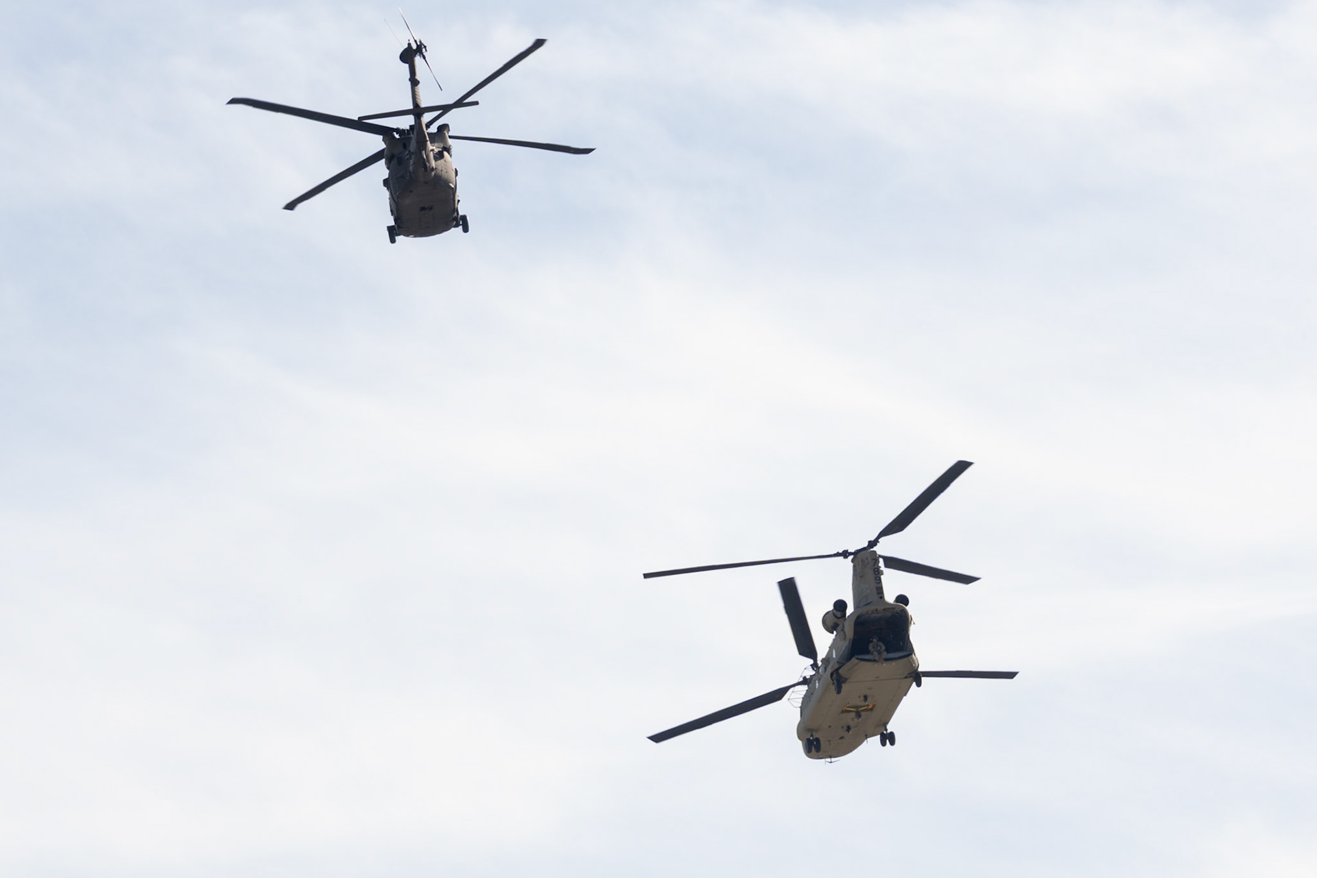 A Boeing CH-47 Chinook and a Sikorsky UH-60 Black Hawk helicopter fly over Gies Memorial Stadium before Illinois’ game against Oregon on Oct. 24, 2026. The Illini defeated the Ducks 21-10 in front of 58,723 fans.
