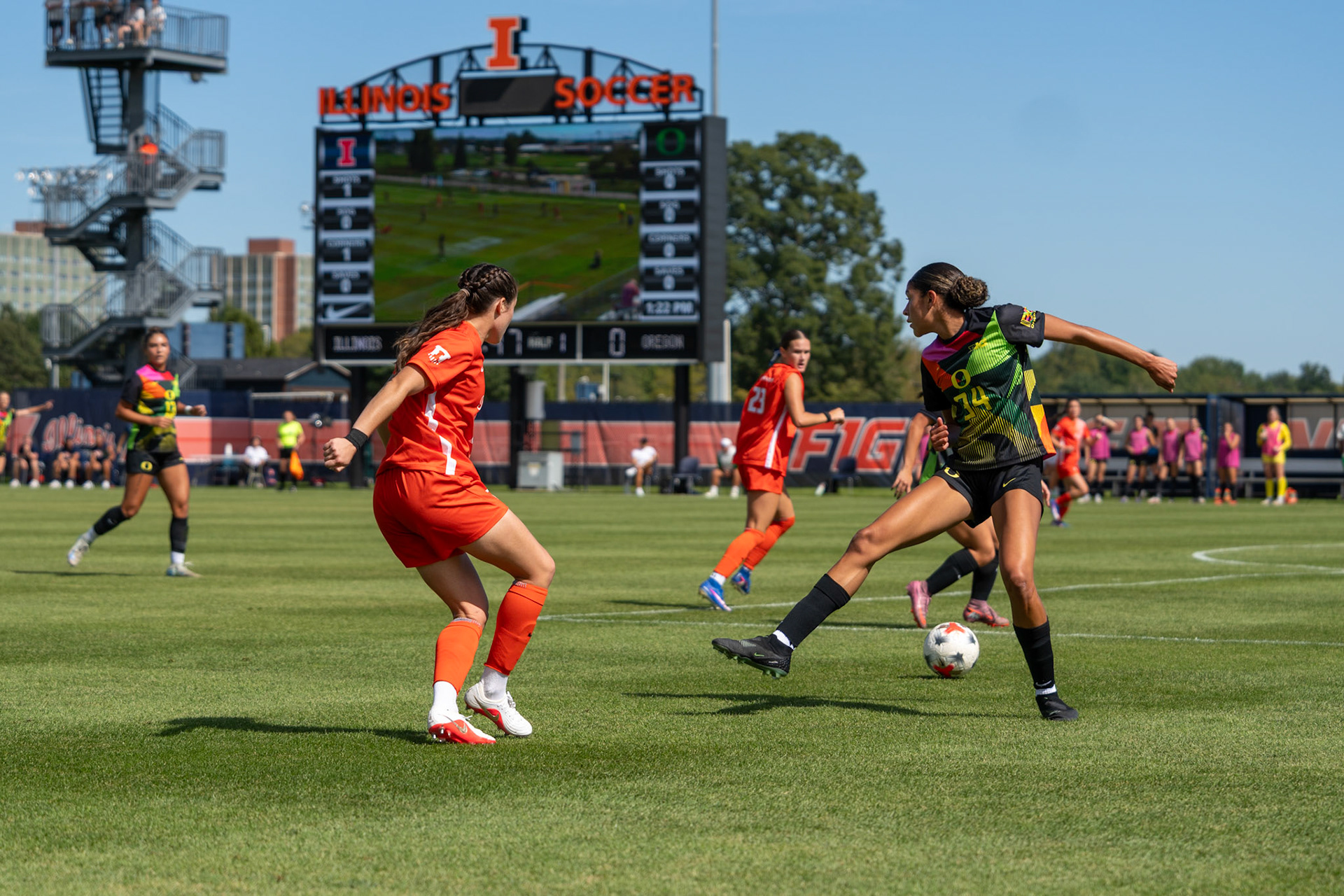 Bella Zanoni, junior defender, threads the ball past Oregon defender Kylie Farmer at Demirjian Park on Sunday. Illinois defeated Oregon 2-0 on Senior Night to improve to 4-2-5 overall on the season.