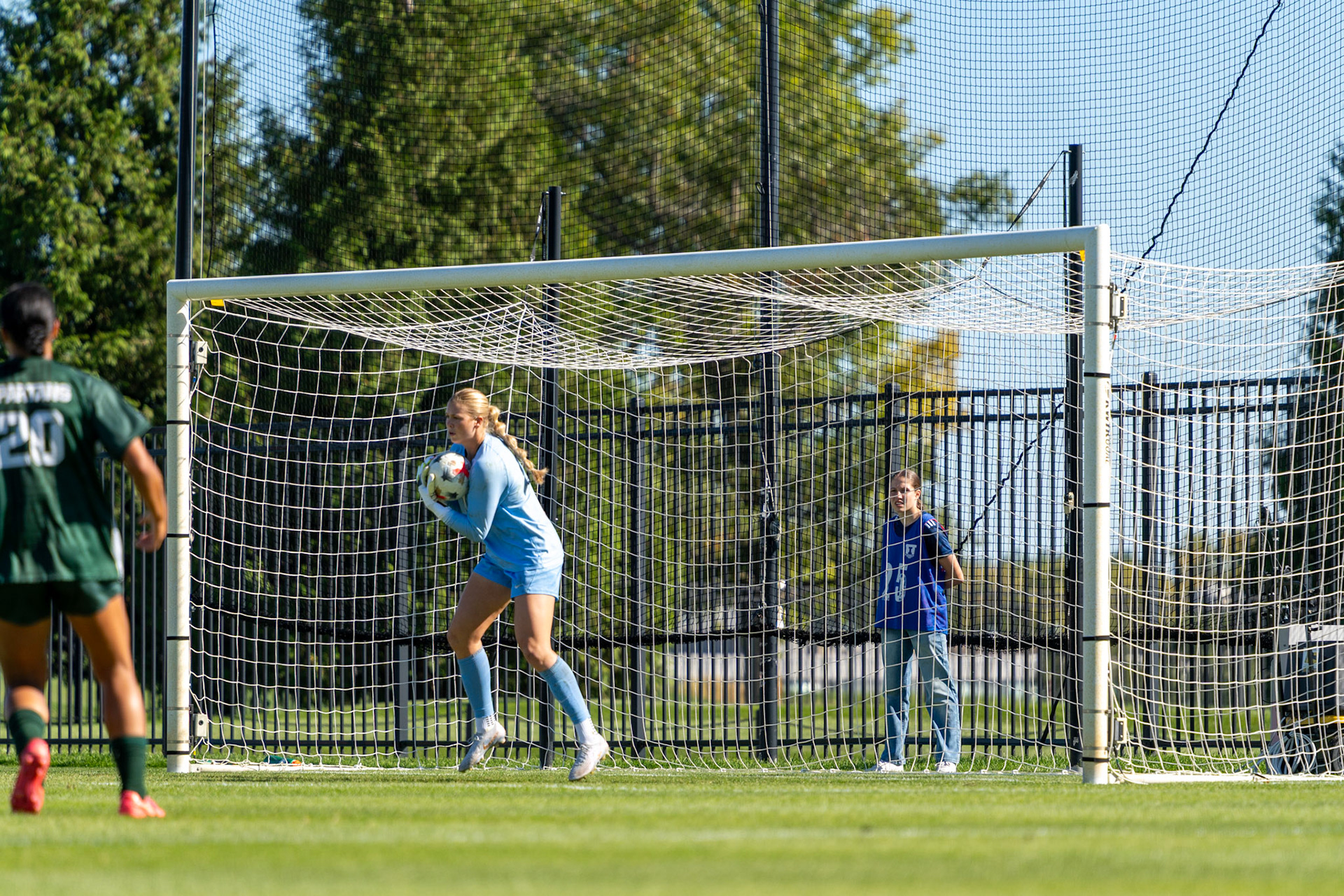 Izzy Lee, fifth-year goalkeeper, catches the ball out of the air against No. 2 Michigan State at Demirjian Park on Oct. 4, 2026. Lee made six saves in Illinois' 1-0 loss to the Spartans.