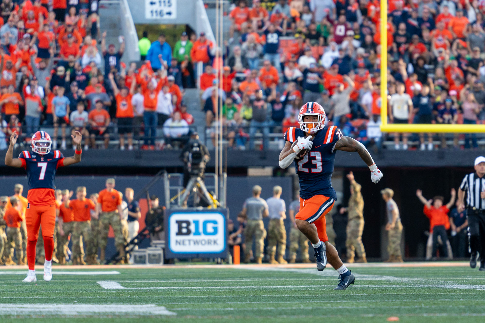 Jordan Anderson, fifth-year running back, breaks off a 33-yard run as quarterback Michael Clayton II celebrates in the background at Gies Memorial Stadium on Oct. 24, 2026. The run set up Illinois’ go-ahead touchdown drive in the fourth quarter of their 21-10 victory.