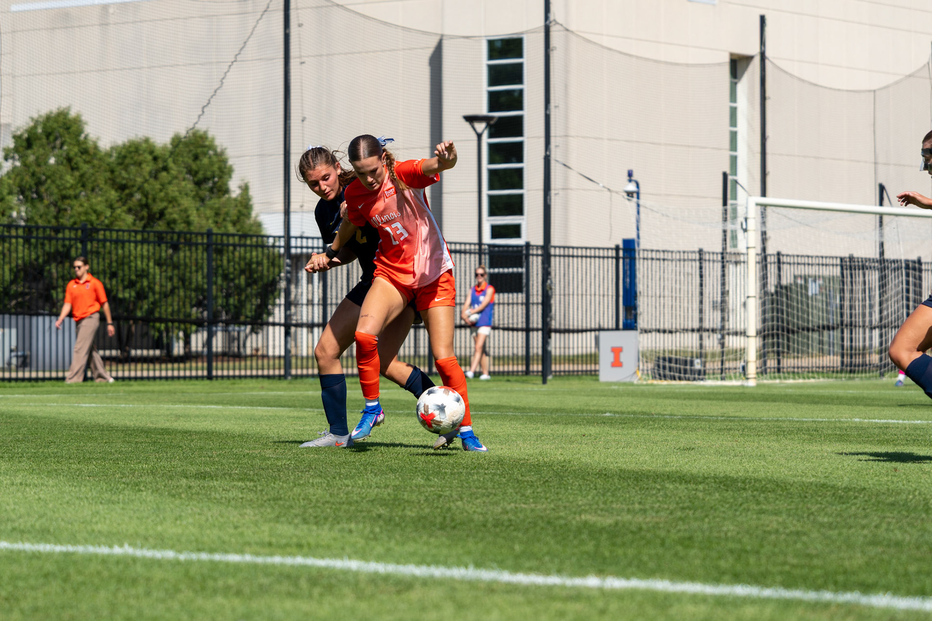 Ashlyn Adams, sophomore forward, battles Michigan defender Anabelle Egeland for possession at Demirjian Park on Sunday. Illinois fell to Michigan 2-0 in the Big Ten contest.