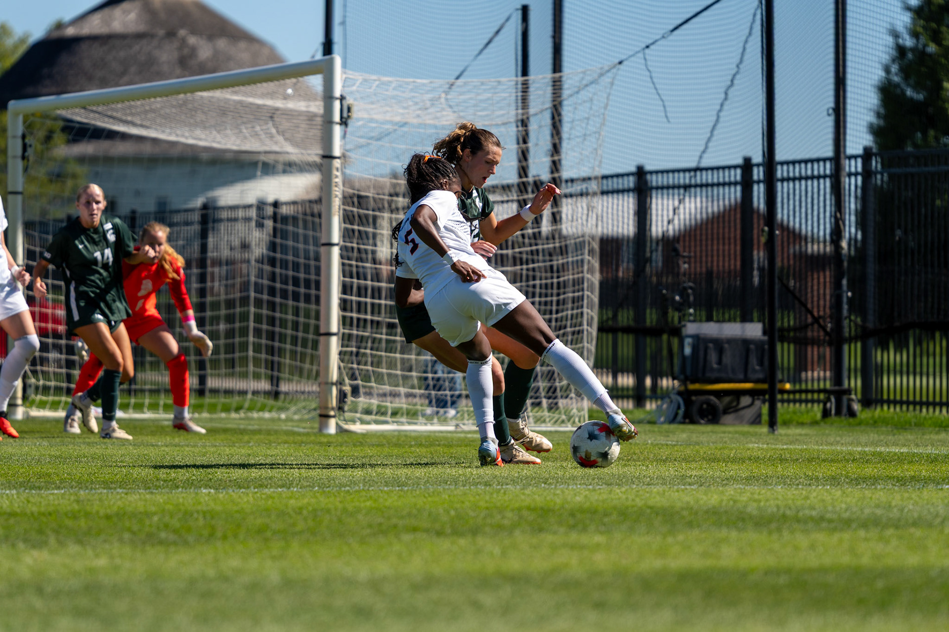 Cayla Jackson, junior forward, holds off pressure from Michigan State defenders at Demirjian Park on Oct. 4, 2026. Illinois fell 1-0 to No. 2 Michigan State after a late goal in the 85th minute.