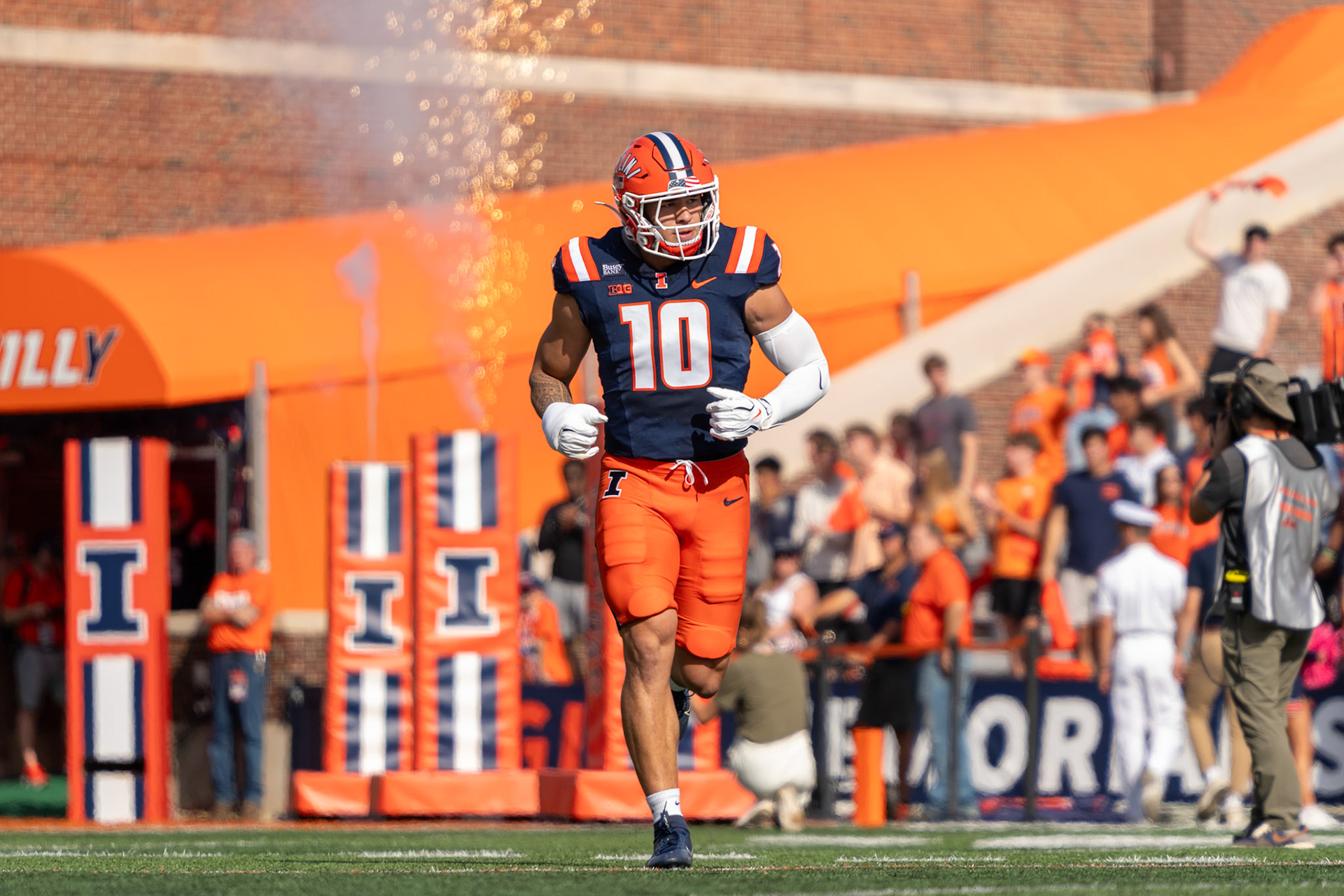 James Kreutz, fifth-year linebacker, runs out of the tunnel before Illinois’ game against Oregon at Gies Memorial Stadium on Oct. 24, 2026. Kreutz finished the game with nine total tackles in Illinois’ 21-10 victory over the Ducks.