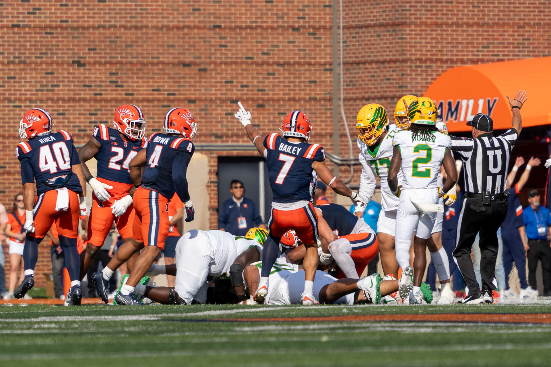 Matthew Bailey, fifth-year defensive back, signals Illinois possession as Joe Barna, junior defensive lineman, recovers a fumble at Gies Memorial Stadium on Oct. 24, 2026. The recovery helped swing momentum in Illinois’ 21-10 victory over Oregon.