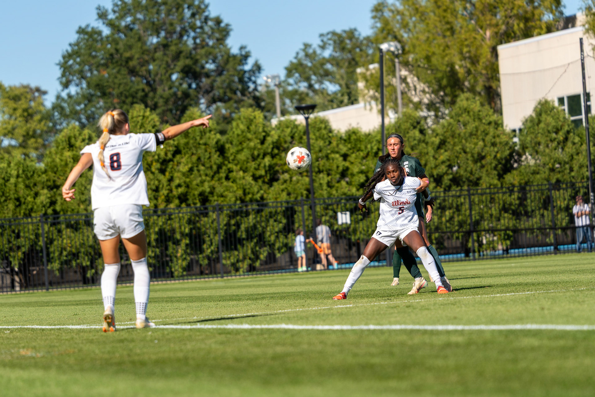 Sutton Webb, fifth-year forward, throws the ball in to Cayla Jackson, junior forward, at Demirjian Park on Oct. 4, 2026. Illinois fell 1-0 to No. 2 Michigan State after a late goal in the 85th minute.