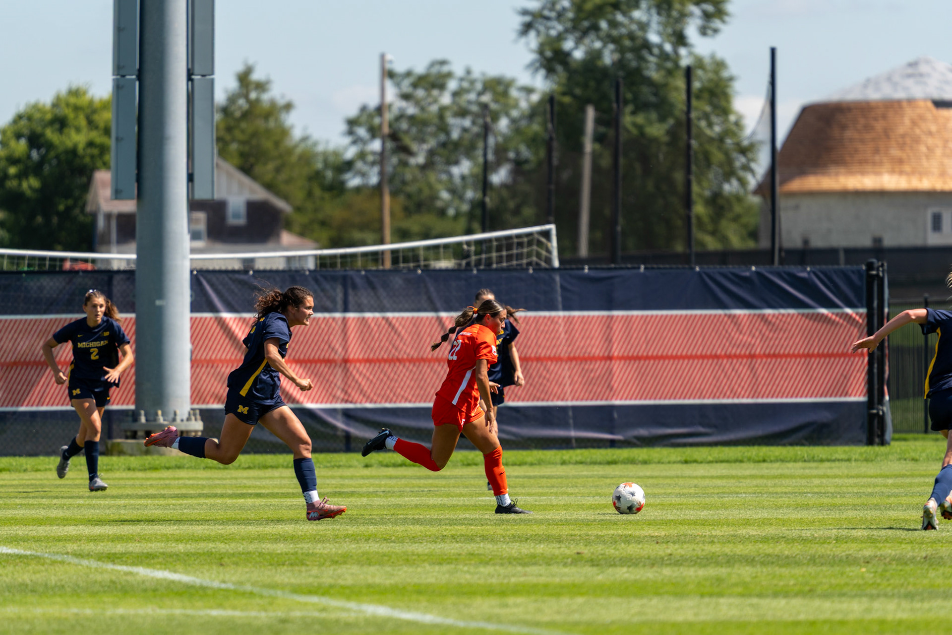 Alyssa White, junior midfielder, pushes the ball up the field against Michigan at Demirjian Park on Sunday. White recorded two shots on the afternoon in Illinois' 2-0 loss.