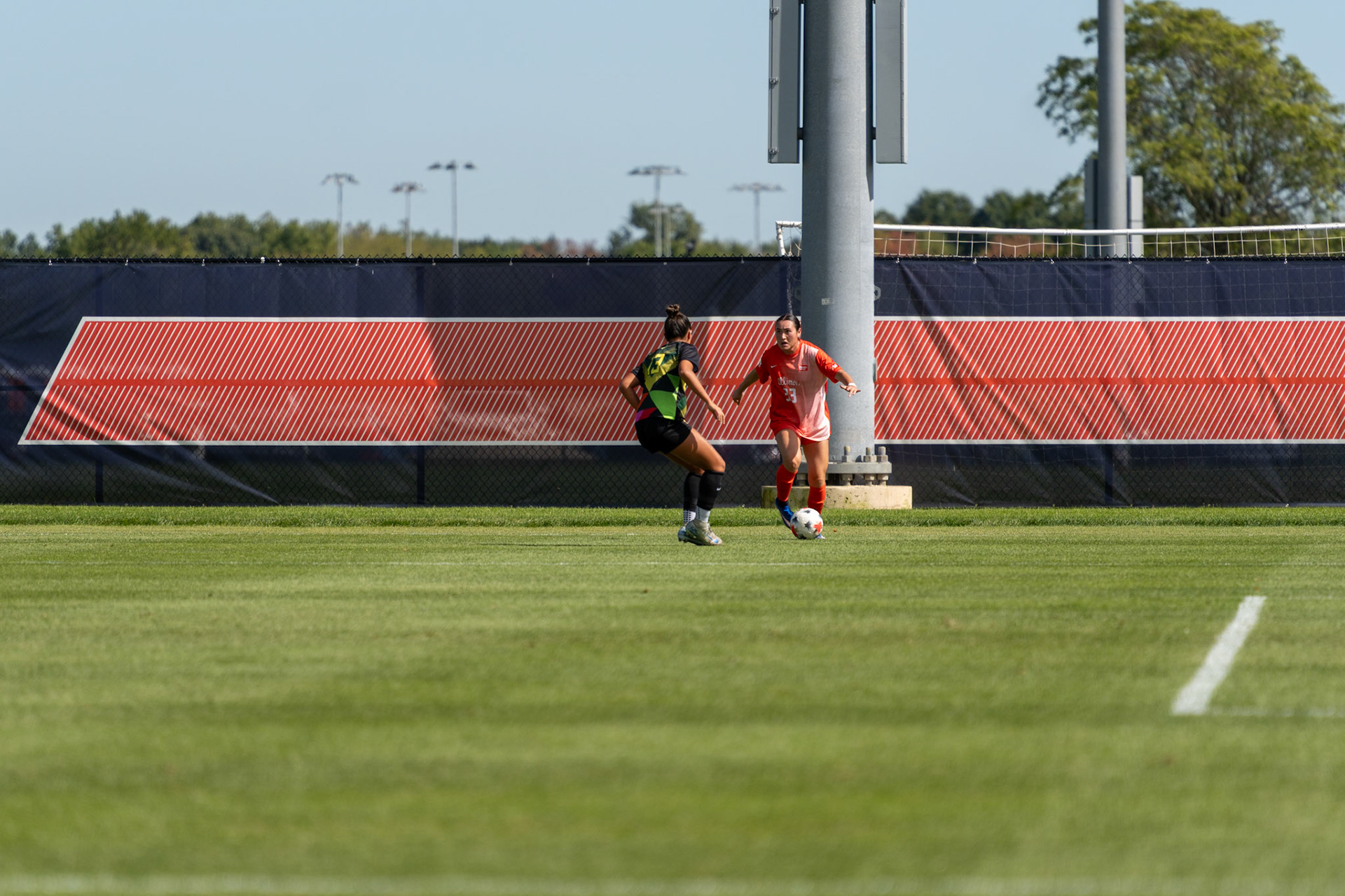 Ava Arengo, senior midfielder, challenges Oregon midfielder Maddie Sharrer one-on-one at Demirjian Park on Sunday. Sharrer received a yellow card in the 14th minute of Illinois' 2-0 Senior Night victory.
