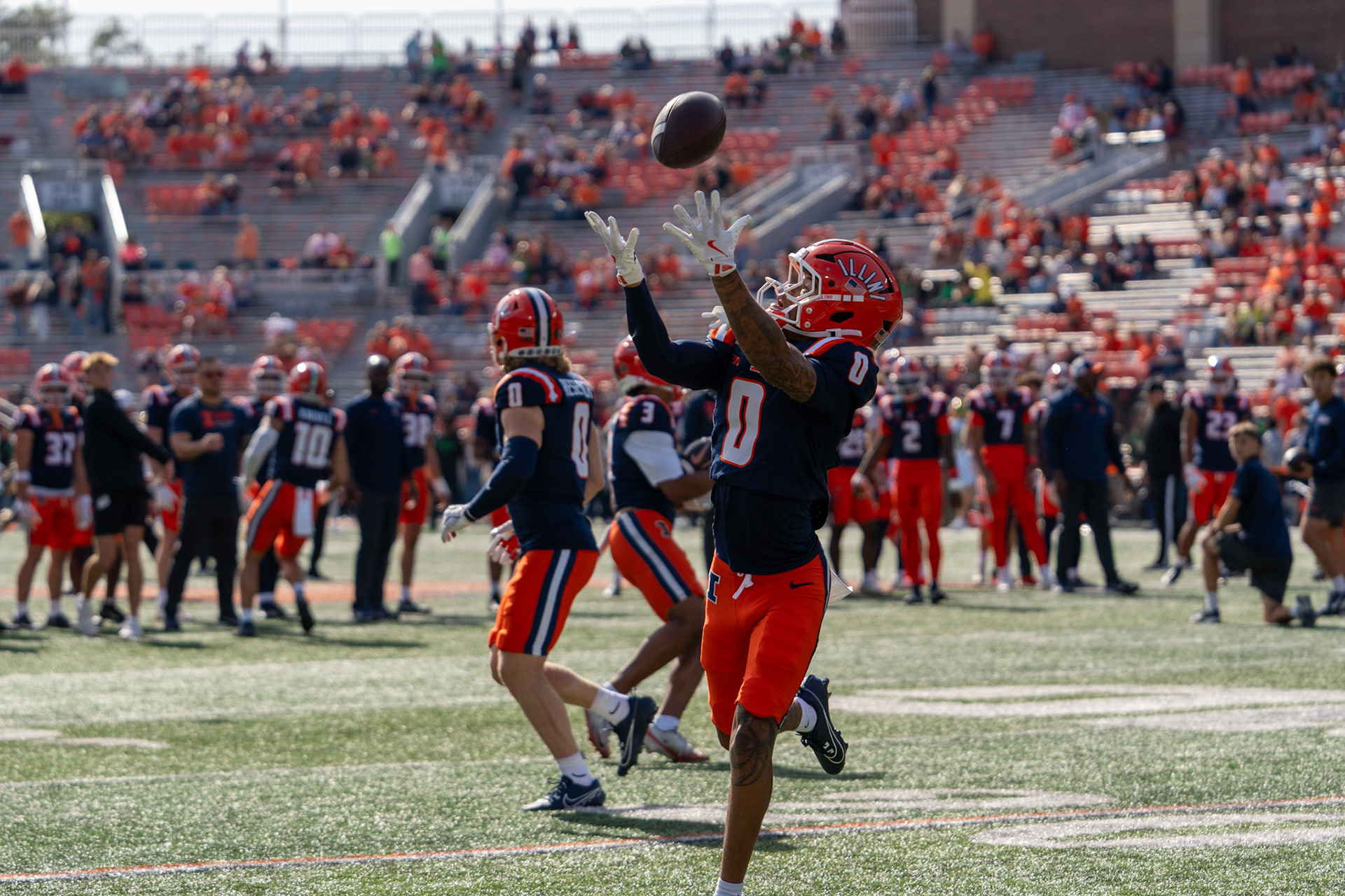 Nas Rankin, freshman wide receiver, catches a pass during warmups before Illinois’ game against Oregon at Gies Memorial Stadium on Oct. 24, 2026. The Illini defeated the Ducks 21-10 in front of 58,723 fans.