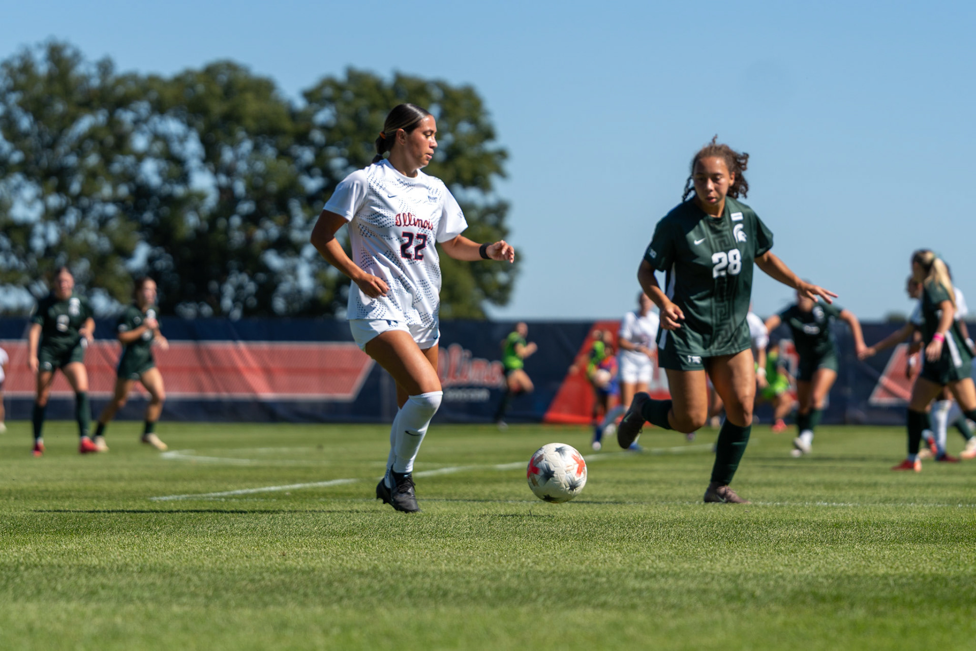Alyssa White, junior midfielder, attempts to get past Michigan State defender Renee Watson at Demirjian Park on Oct. 4, 2026. Illinois fell 1-0 to No. 2 Michigan State after a late goal in the 85th minute.