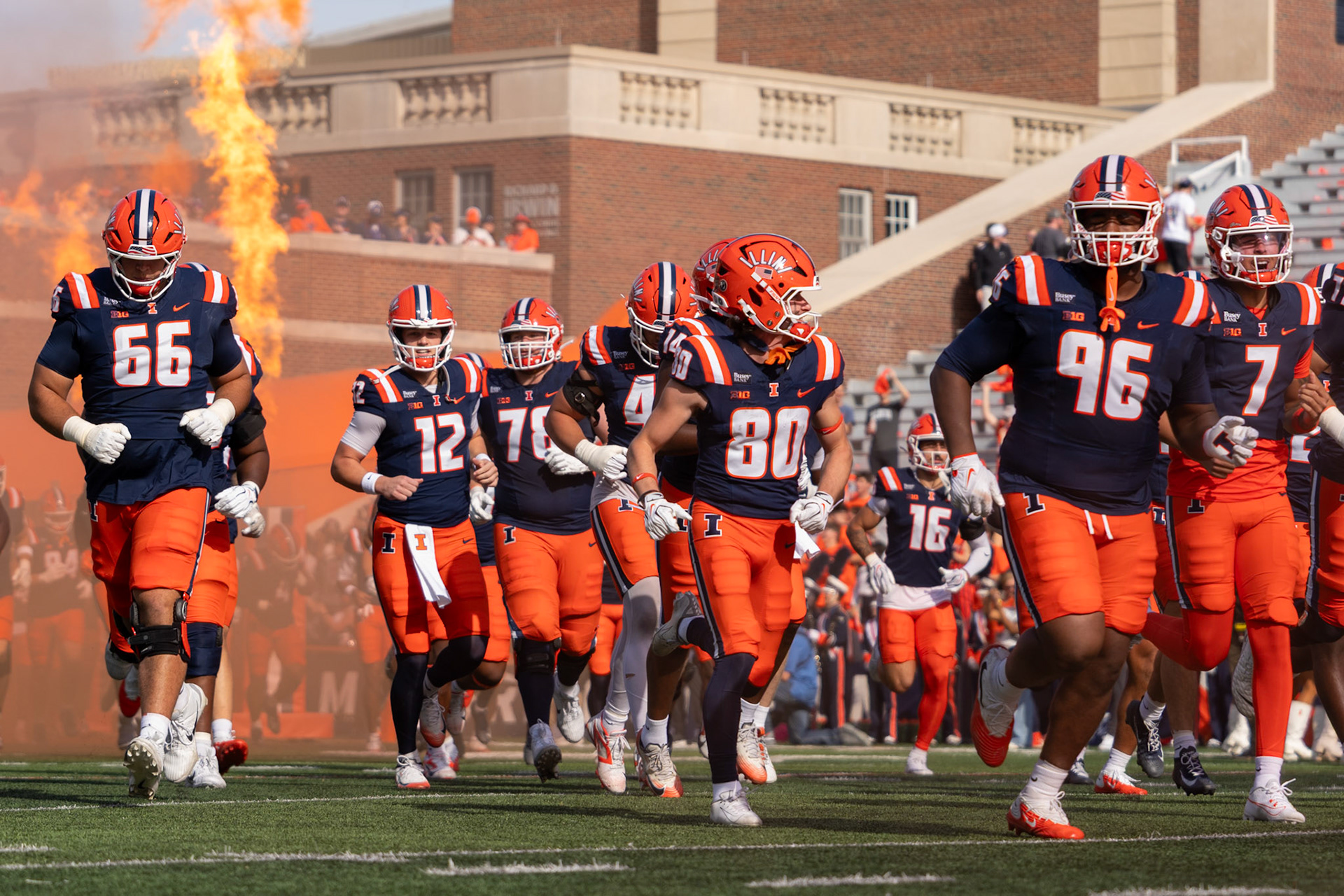 Illinois football players run out of the tunnel before their game against Oregon at Gies Memorial Stadium on Oct. 24, 2026. The Illini defeated the Ducks 21-10 in front of 58,723 fans.