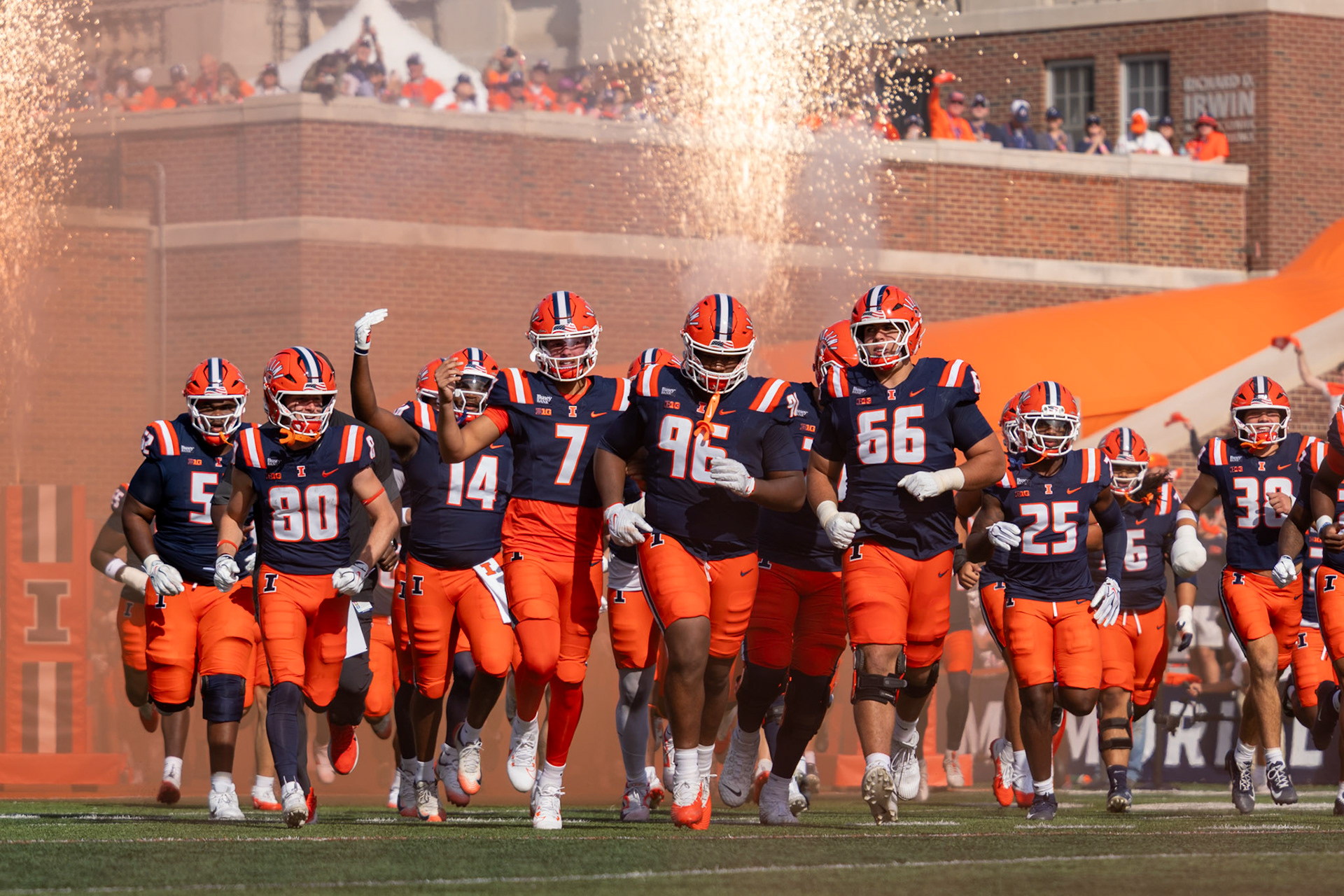 Illinois football players run out of the tunnel before their game against Oregon at Gies Memorial Stadium on Oct. 24, 2026. The Illini defeated the Ducks 21-10 in front of 58,723 fans.