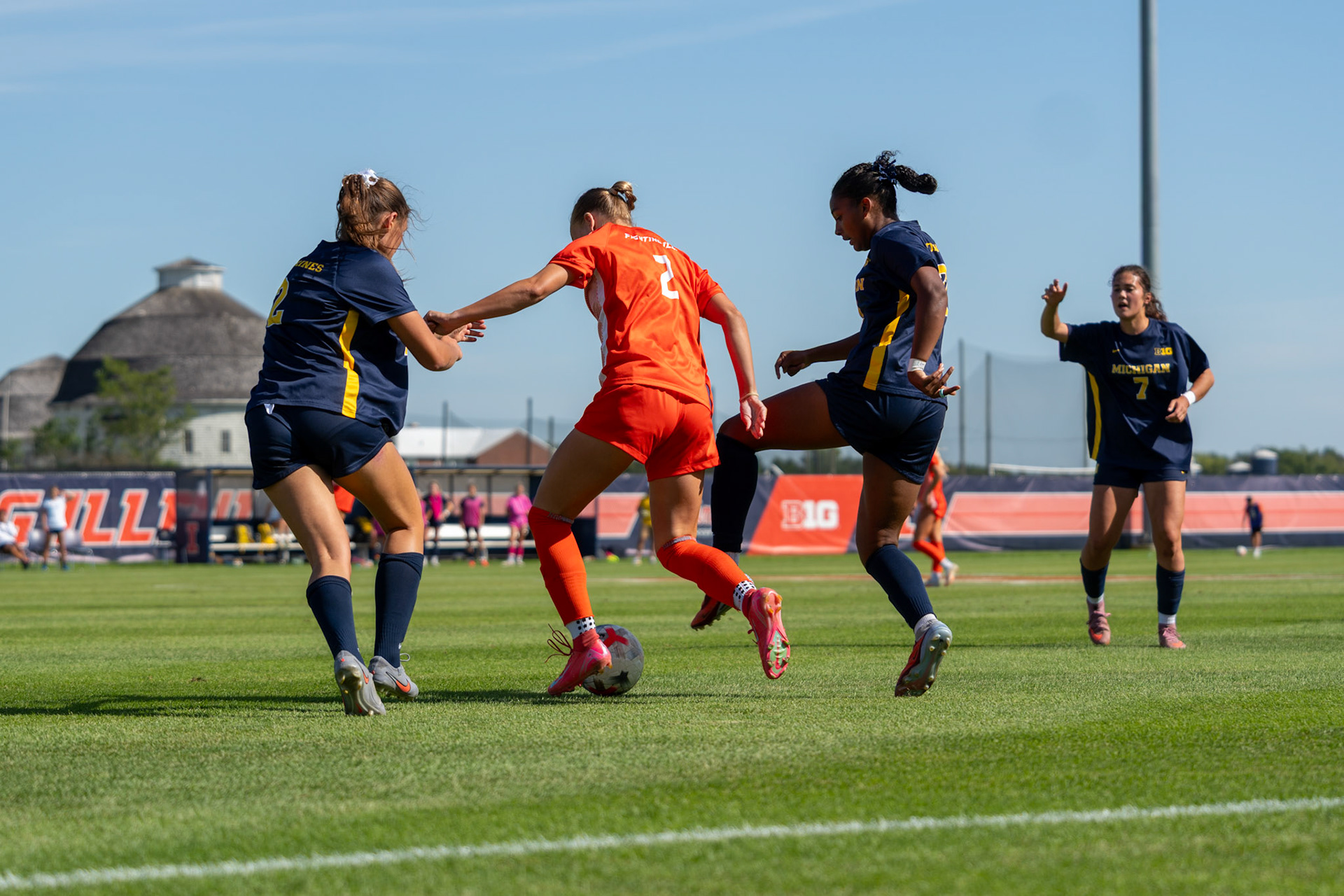 Ryleigh Wood, sophomore forward, battles Michigan defender Anabelle Egeland and midfielder Maya Raghunandanan at Demirjian Park on Sunday. Illinois fell to Michigan 2-0 in the Big Ten contest.