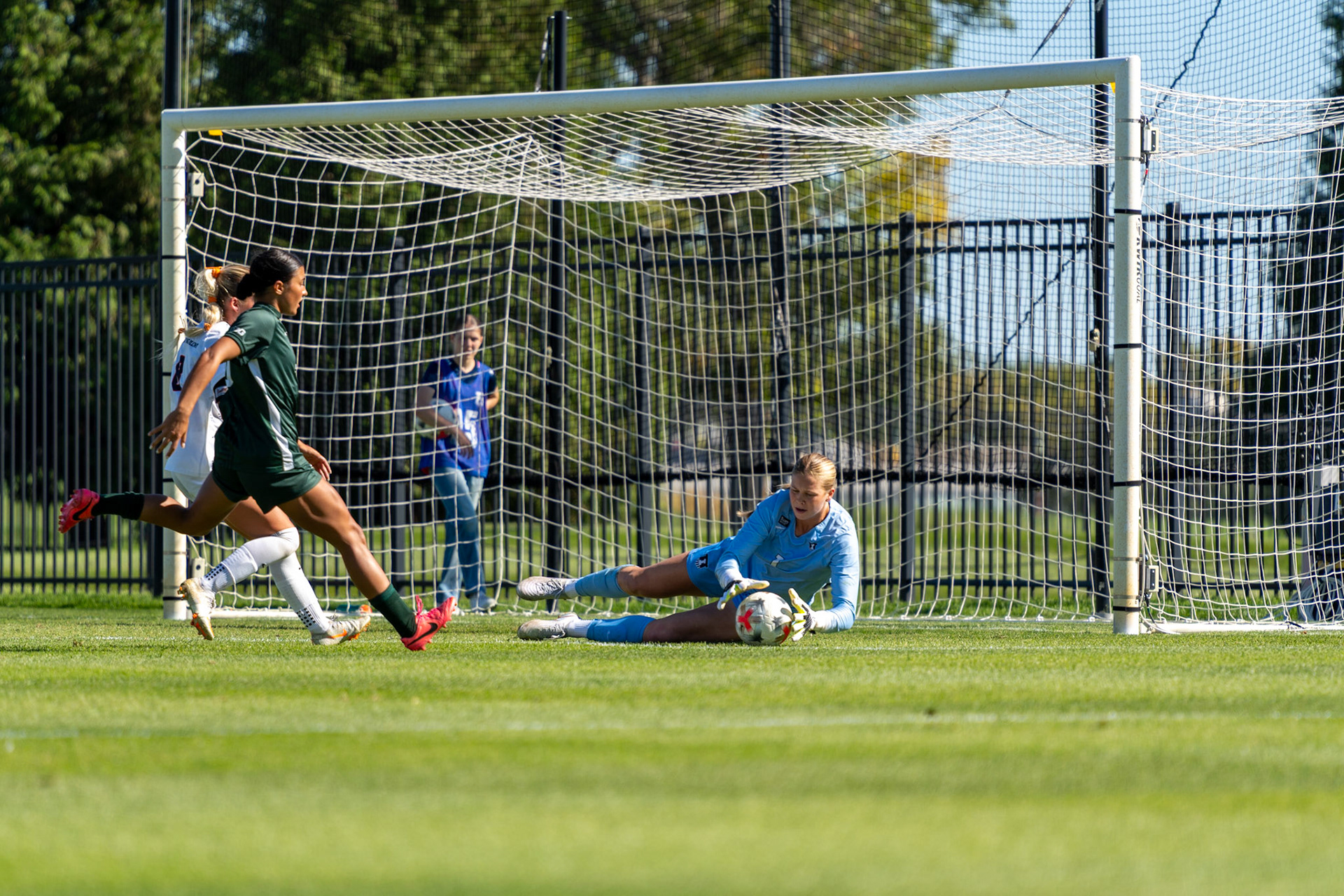 Izzy Lee, fifth-year goalkeeper, makes a diving save at Demirjian Park on Oct. 4, 2026. Lee made six saves in Illinois' 1-0 loss to No. 2 Michigan State.