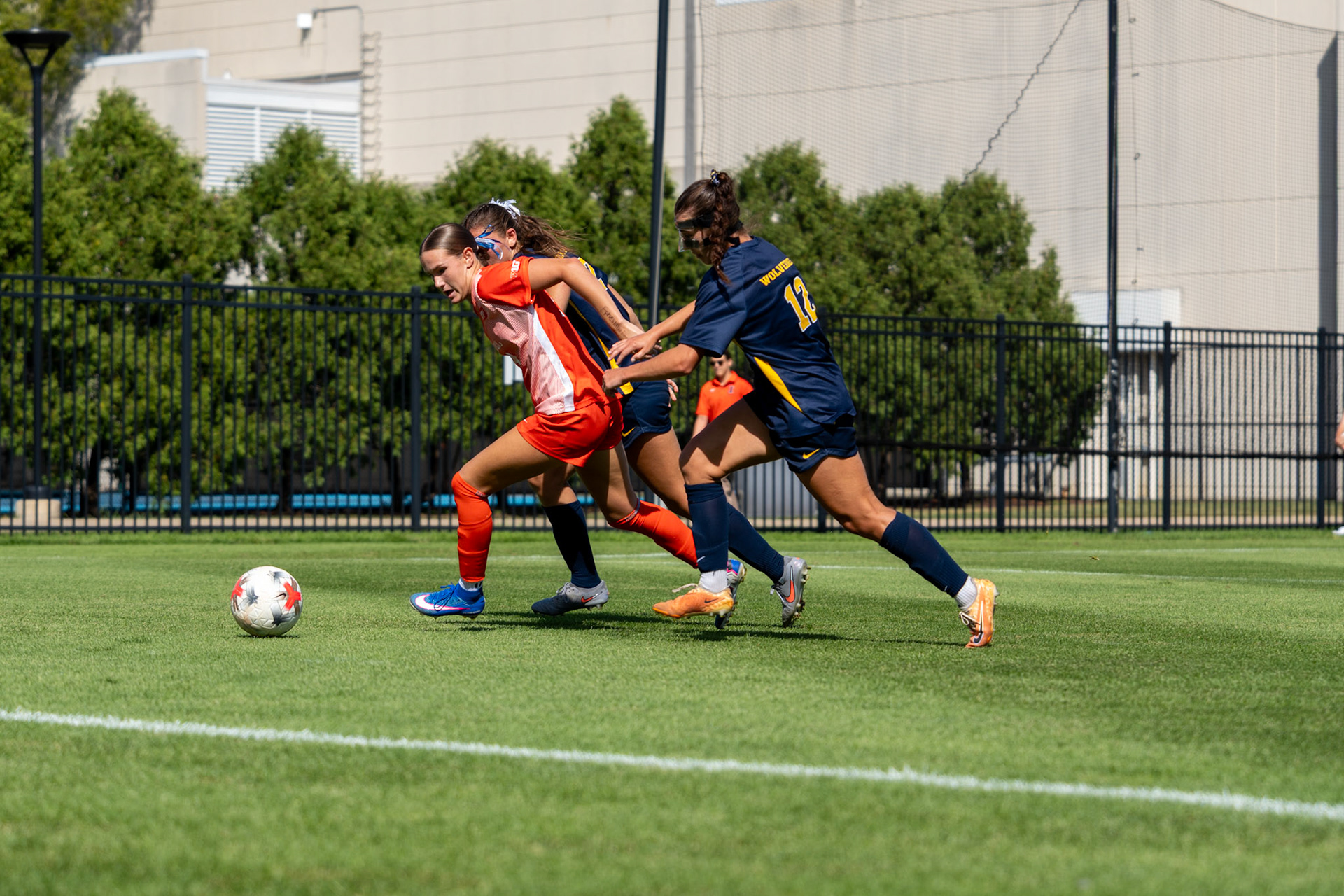 Ashlyn Adams, sophomore forward, challenges Michigan defender Anabelle Egeland and midfielder Rylie McKinney for possession at Demirjian Park on Sunday. Illinois fell to Michigan 2-0 in the Big Ten matchup.