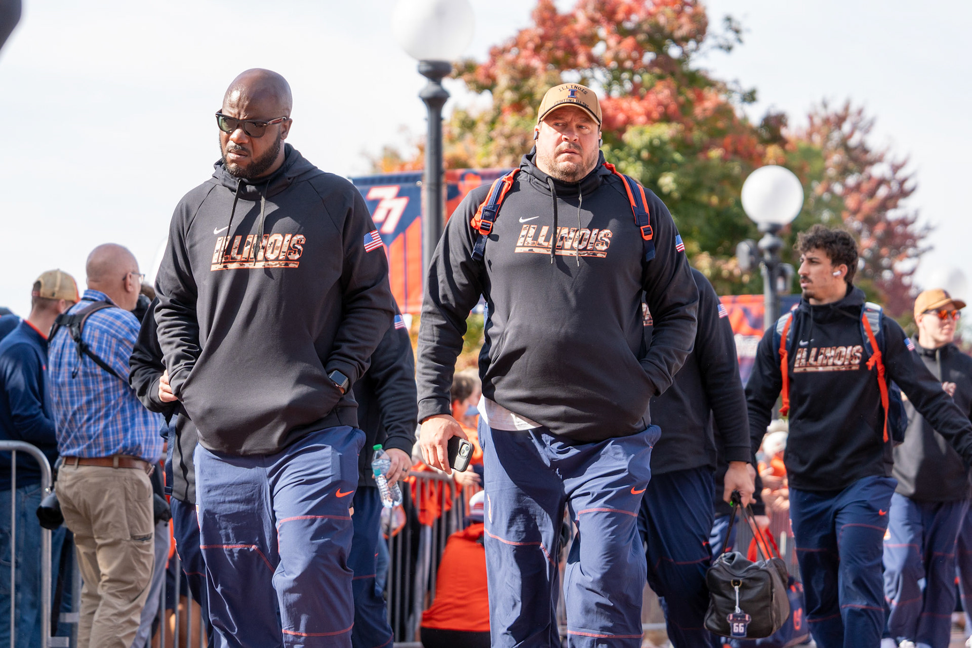 Illinois players walk through Grange Grove during the Illini Walk before their game against Oregon at Gies Memorial Stadium on Oct. 24, 2026. The Illini defeated the Ducks 21-10 in front of 58,723 fans.