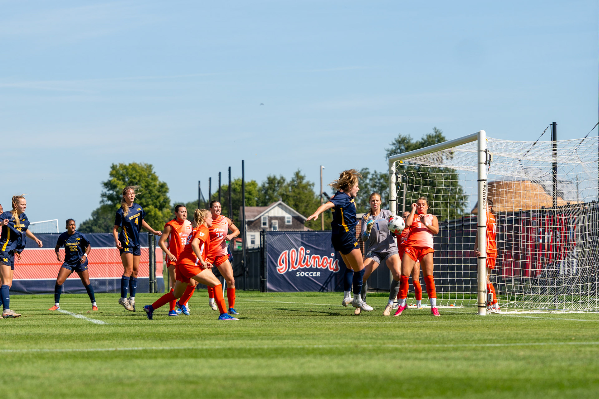 Illinois players move to block a Michigan shot attempt at Demirjian Park on Sunday. The Wolverines outshot the Illini 7-6 in their 2-0 victory.