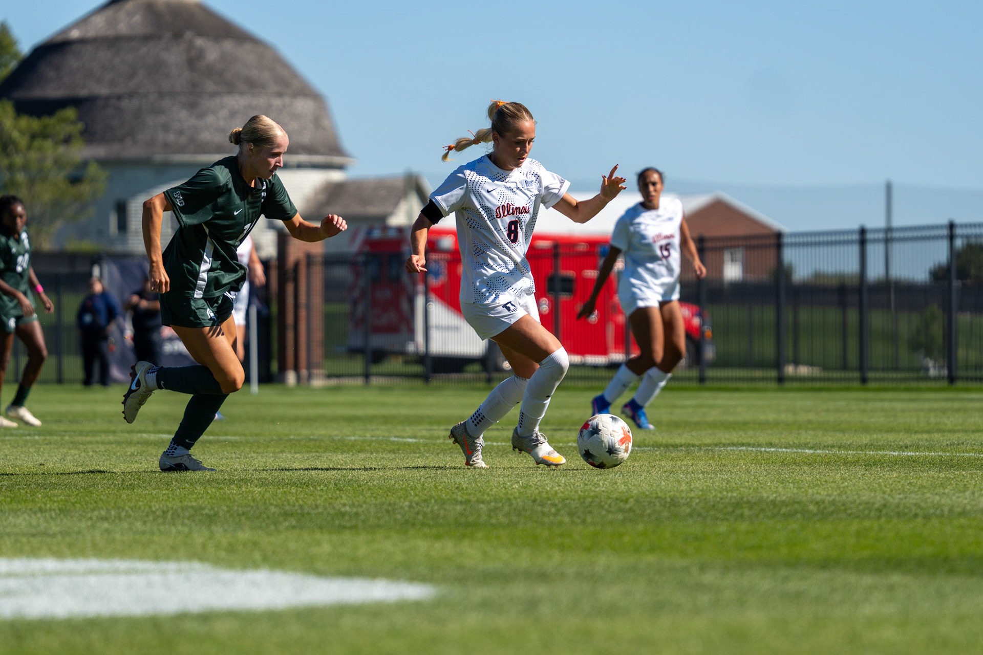 Sutton Webb, fifth-year forward, advances the ball with Michigan State defender Faith George in pursuit at Demirjian Park on Oct. 4, 2026. Illinois fell 1-0 to No. 2 Michigan State after a late goal in the 85th minute.