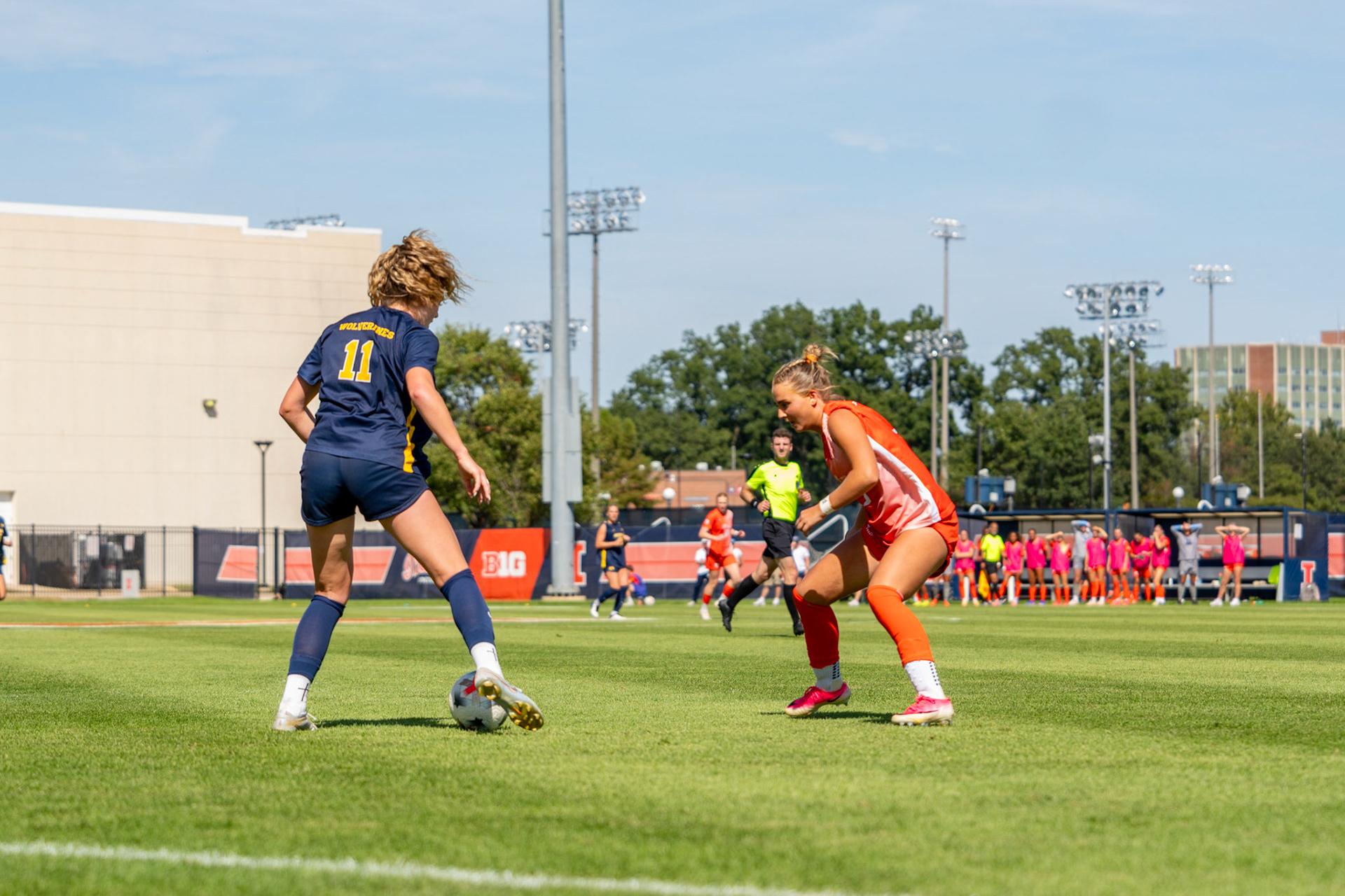Michigan forward Elle Ervin challenges Illinois defender/midfielder Lauren Seppi for possession at Demirjian Park on Sunday. Ervin scored the opening goal of the match on a penalty kick in the 17th minute.