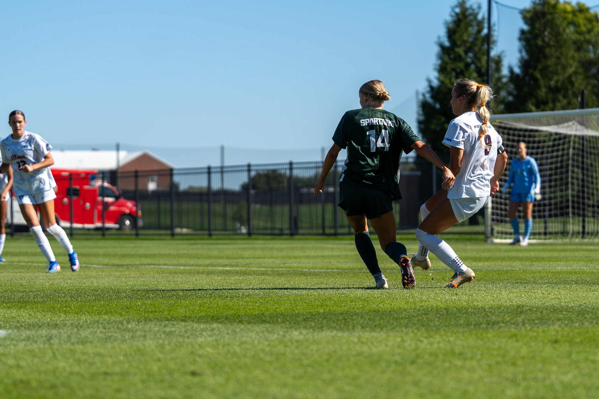 Sutton Webb, fifth-year forward, plays the ball forward with Michigan State defender Faith George alongside her at Demirjian Park on Oct. 4, 2026. Illinois fell 1-0 to No. 2 Michigan State after a late goal in the 85th minute.