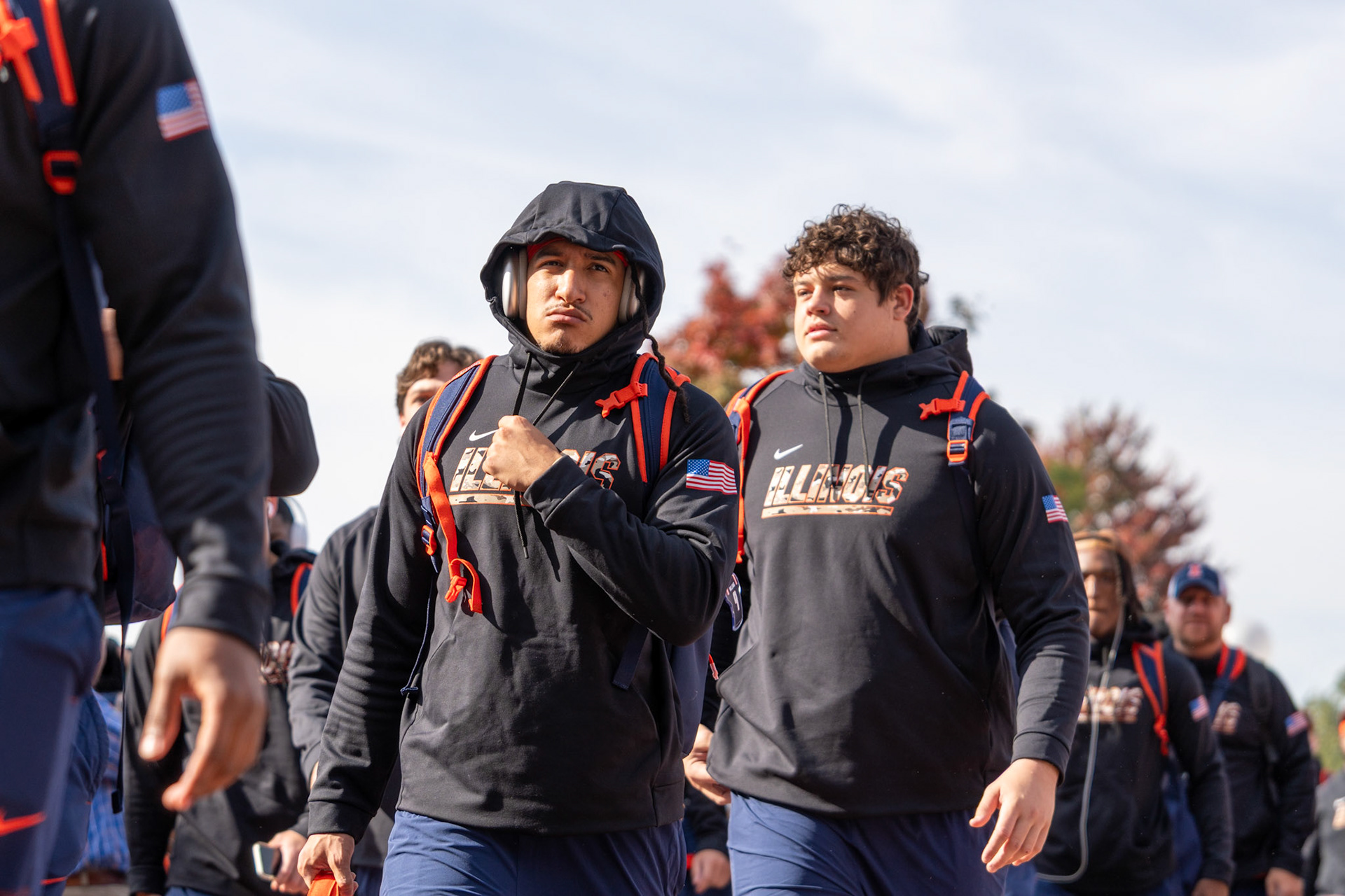 Illinois players walk through Grange Grove during the Illini Walk before their game against Oregon at Gies Memorial Stadium on Oct. 24, 2026. The Illini defeated the Ducks 21-10 in front of 58,723 fans.